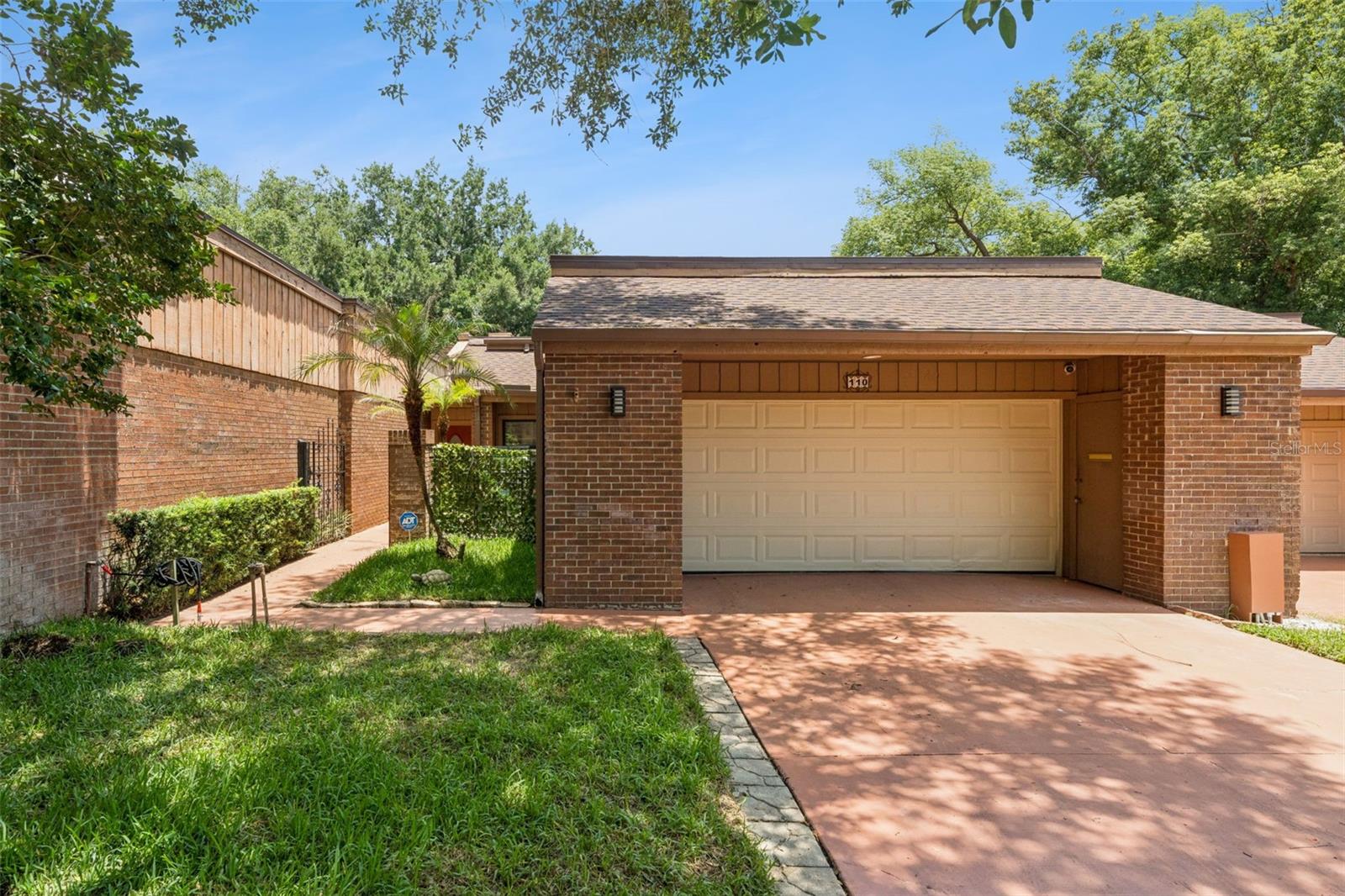 Beautifully updated townhouse tucked within the guard gated community of The Springs and ideally positioned on a private cul de sac with the community pool just across the street. Surrounded by mature trees and natural beauty, this home offers soaring ceilings, skylights, and a bright open layout that fills the home with natural light.

The expansive living and dining areas are centered around a cozy wood burning fireplace and create a comfortable layout that works beautifully for both relaxed evenings at home and entertaining. Updated throughout, the home features vinyl flooring, all new kitchen appliances, refreshed bathrooms, and a loft that has been converted into a fourth bedroom. The split bedroom floor plan provides added privacy, while the spacious primary suite includes a sitting area and overlooks the fenced backyard patio.

Outdoor spaces are designed for enjoying Florida living, with a private fenced patio surrounded by peaceful natural scenery and mature trees. Major updates include a new roof in 2023, new AC unit for the primary suite and fourth bedroom, a 2020 AC system for the remainder of the home, and a new water heater. The community pool located just across the street offers an easy way to enjoy long summer days by the pool just moments from home.

The Springs is a community like no other, an immersive natural sanctuary where residents stroll beneath century old Live Oaks, walking and jogging paths, horse stables, a clubhouse, pool, and a full calendar of community events. Wildlife and native Florida woodlands are part of daily life here. The Springs is also prized for its highly desired top-rated schools, and is conveniently located less than 1 mile from I-4, with easy access to Altamonte Springs, Lake Mary, Winter Park, farmer’s markets,Crane's roost, shopping, dining, vibrant restaurants, the beaches and attractions. Longwood offers a small-town vibe while being just a short drive from all that Orlando is known for. A rare opportunity to enjoy space, privacy, and true Florida living.