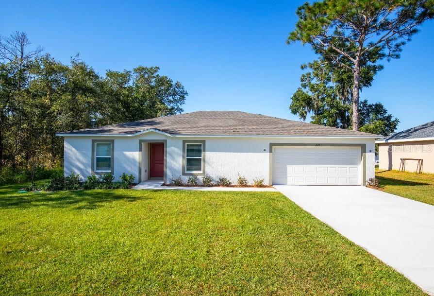 Pre-Construction. To be built. Discover The Iris, a beautifully designed home in an established DeBary neighborhood, perfectly positioned between Orlando and Daytona Beach. Enjoy a peaceful, tree-lined setting with more than 200 sunny days each year, less than five miles from the St. Johns River, and easy access to shopping, dining, major employers, and SunRail commuter service.

Eye-catching curb appeal, professional landscaping, and a protected front entry set the stage for what awaits inside. Just off the foyer, a spacious den creates the perfect space for a home office, media room, or flex area tailored to your needs.

The open-concept design centers around a spacious kitchen featuring quartz countertops, abundant cabinetry, stainless steel appliances, a walk-in pantry, and a large island with bar-top seating. The kitchen flows effortlessly into the bright Great Room, where sliding glass doors open to an extended patio, creating the ideal indoor-outdoor living experience.

The private primary suite is designed for relaxation with a large walk-in closet, dual vanities, and a spacious walk-in shower. Three additional bedrooms with built-in closets share a full bath, provide flexibility and comfort.

Ceramic tile flooring enhances the main living areas, while carpeting adds warmth to the bedrooms. ENERGY STAR® windows and horizontal blinds improve comfort and efficiency throughout. A spacious laundry and mudroom conveniently connects to the two-car garage for added functionality.

Smart home features include a Ring Video Doorbell, Smart Thermostat, Keyless Entry Smart Door Lock, and Deako Smart Switches. Architectural shingles, full landscaping, and a comprehensive builder warranty complete the package.

With no HOA and a location that combines natural beauty with everyday convenience, The Iris floor plan delivers the Florida lifestyle you've been looking for.