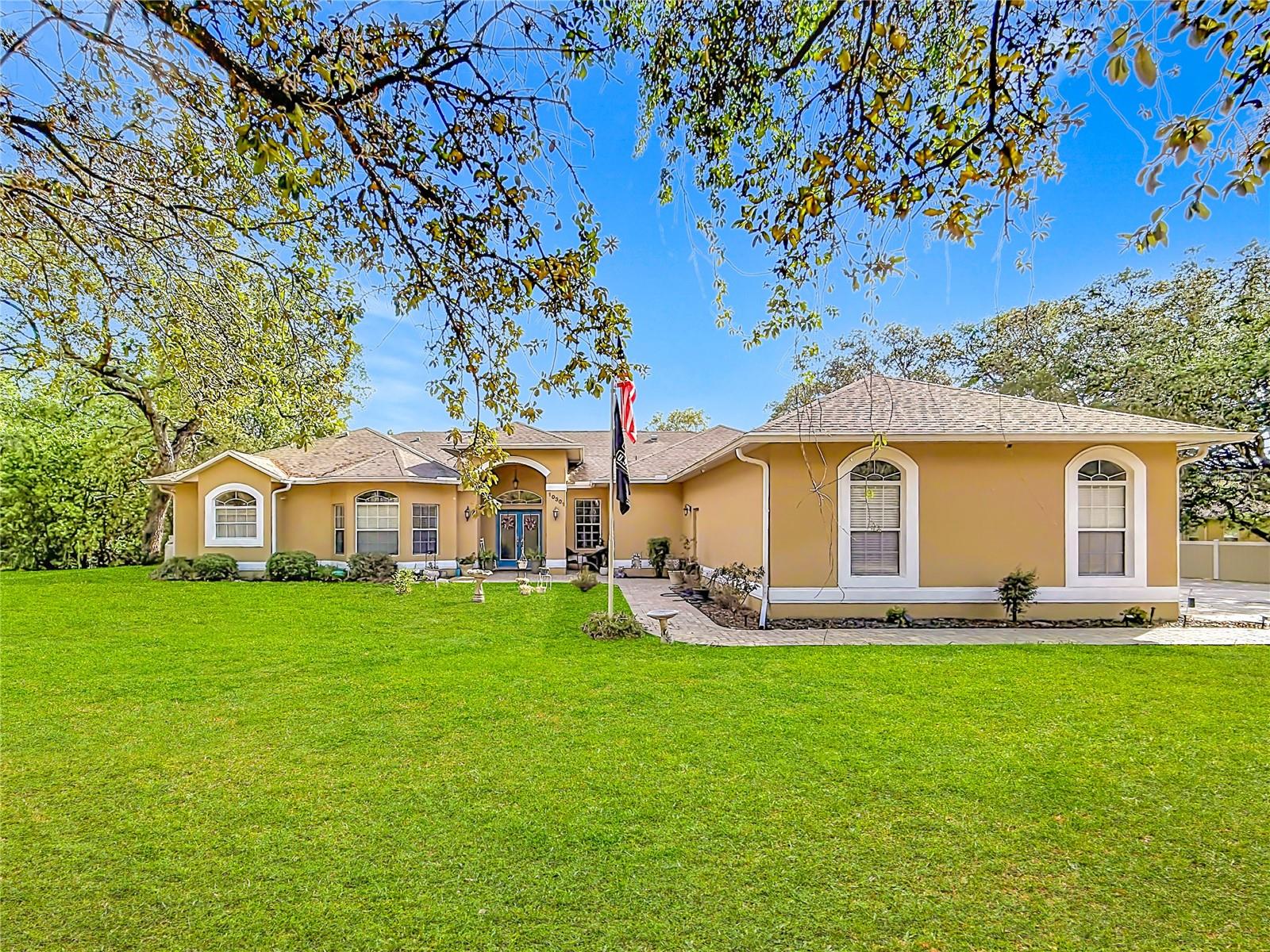 Rare opportunity to own this impressive 5-bedroom, + office, 4-bath pool home with a 3-car garage, situated on a fully fenced 1-acre homesite. A brand-new roof will be installed prior to closing. From the double-door entry, step into a spacious formal dining area highlighted by tray ceilings, a wet bar, sliders to the lanai and pool, and a beautiful double-sided gas fireplace. The generous eat-in kitchen features granite countertops with bar seating, abundant cabinetry, a large pantry, and an open layout that flows seamlessly into the living room, also accented with tray ceilings. The expansive primary suite offers dual walk-in closets and a well-appointed bath with a jetted tub, dual vanities, and a tiled shower. Bedrooms two and three each include walk-in closets and share a Jack-and-Jill bath with an updated vanity, while the separate fourth bedroom is conveniently located near another full bath. The fifth bedroom, previously used as an office, now includes a closet, and the oversized dedicated office provides excellent flexibility as a possible sixth bedroom. A fourth full bath serves as a convenient pool bath and features an updated vanity. The dedicated laundry room includes the washer, dryer, utility sink, and shower, with an additional large storage area located nearby. Step out back to enjoy the Diamond Brite pool, peaceful backyard views, and built-in fire pit—perfect for relaxing or entertaining. Additional updates and features include two A/C units replaced in 2018, well pump replaced in 2022, septic and drainfield replaced in 2022, water heater replaced in 2021, central vacuum, and an included shed. This home offers both comfort and endless potential in one of the area’s most desirable neighborhoods. This home is minutes from the famous Weeki Wachee live mermaids, Pine Island Park and Roger’s Park for fun on the water. Close to the Suncoast parkway for quick access to the airport, Tampa, Clearwater and St. Pete Beaches (Ranked in the top 5 Beaches in the US), also close to the famous Tarpon Springs Sponge Docks. Enjoy everything Tampa Bay has to offer.  Go just to the north and you’ll find Chassahowitzka National Wildlife refuge, Homosassa Springs, Crystal River and Cedar Key on the Suwannee Sound.  Beautiful gulf and river boating, terrific fishing, TOP US BEACHES, golfing, cultural entertainment, and museums...and of course beautiful year-round weather. Repaired Sinkhole. Docs on file