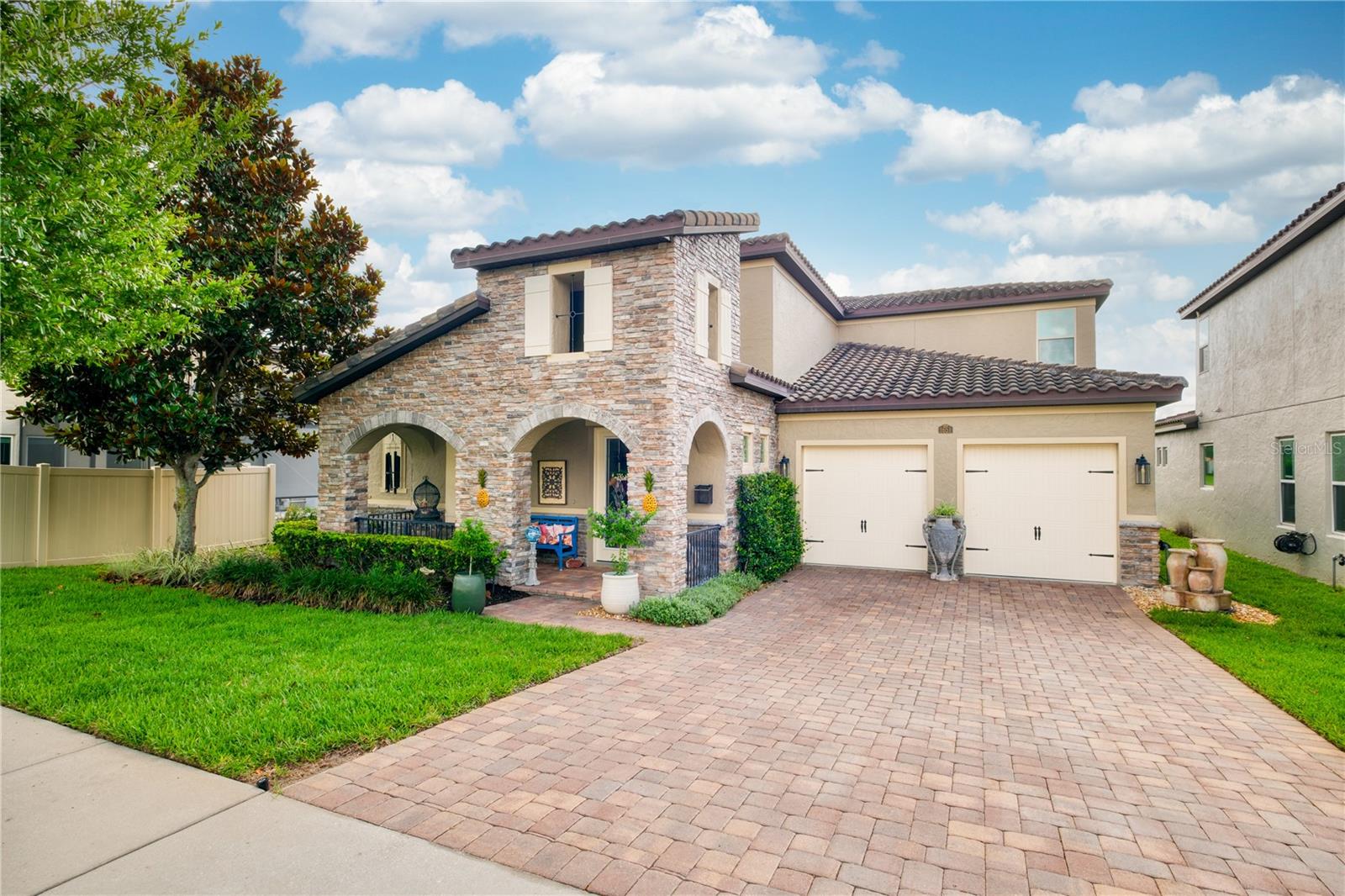 Welcome home to this beautifully maintained 4-bedroom, 3 full bath, residence in sought-after Twinwaters. Featuring a designer kitchen with full-extension soft-close drawers and cabinets, 10-foot ceilings on the main level, 9-foot ceilings upstairs, crown molding, and central vacuum, this home offers both comfort and thoughtful upgrades throughout.  Enjoy peaceful views of the expansive conservation area from your backyard with no rear neighbors, creating a private and relaxing setting. Professionally designed landscaping provides year-round color and fragrance, while local songbirds add to the natural charm. On clear evenings, catch a glimpse of Disney fireworks from home.  Conveniently located just minutes from historic Downtown Winter Garden, shopping, dining, and premier golf destinations including Orange County National. Complete with a spacious 2-car garage, this warm and inviting home is ready for its next owner. Schedule your private showing today!
