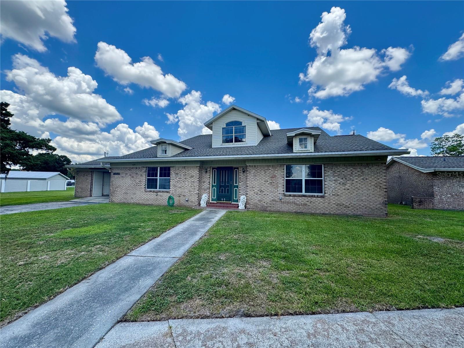 Unique Property with Endless Potential! This older home is ready for repairs and updating, offering a great opportunity to customize and add value. The main home features 2 bedrooms and 1.5 bathrooms downstairs, plus 1 bedroom and 1 bathroom upstairs. The upper level includes a spacious tiled flex area ideal for a family room, office, game room, or additional living space, along with a balcony overlooking the inground pool. Adjacent to the home is an approximately 1,000 sq. ft. accessory dwelling unit (ADU) featuring a living room, full kitchen, bedroom, bathroom, and screened porch. Perfect for multi-generational living, guest accommodations, or rental income potential. Property offers plenty of possibilities for the right buyer.