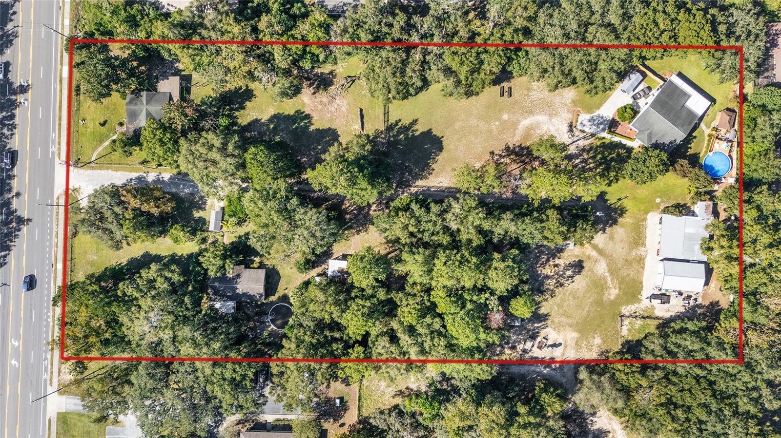 Exceptional mixed-use opportunity spanning 3.38 acres along the high-traffic West Gulf to Lake Highway corridor in Crystal River. The property consists of three potential income-producing homes across four parcels, creating an attractive investment for developers, professional users or portfolio investors. With zoning that includes Professional Service Office (PSO) for the two front residences, the site is ideal for medical, legal, or professional office conversion while maintaining interim income. The property is surrounded by the Meadowcrest medical community, a hub of established practices and offices, positioning this site as a strategic location for healthcare professionals seeking proximity to existing services. Its prime visibility along Highway 44 ensures maximum exposure for any professional or commercial use. Three parcels are included in this sale: 5985 West Gulf to Lake Highway, 1240 North Henry Point and 1241 North Henry Point. Public utilities are available, and configuration offers depth, access and flexibility for future development, expansion or continued residential leasing. This assemblage presents a rare balance of potential income and long-term redevelopment within one of Citrus County’s active professional corridors. Investors, owner-occupants and developers will appreciate the visibility, accessibility and scalability of this unique property.