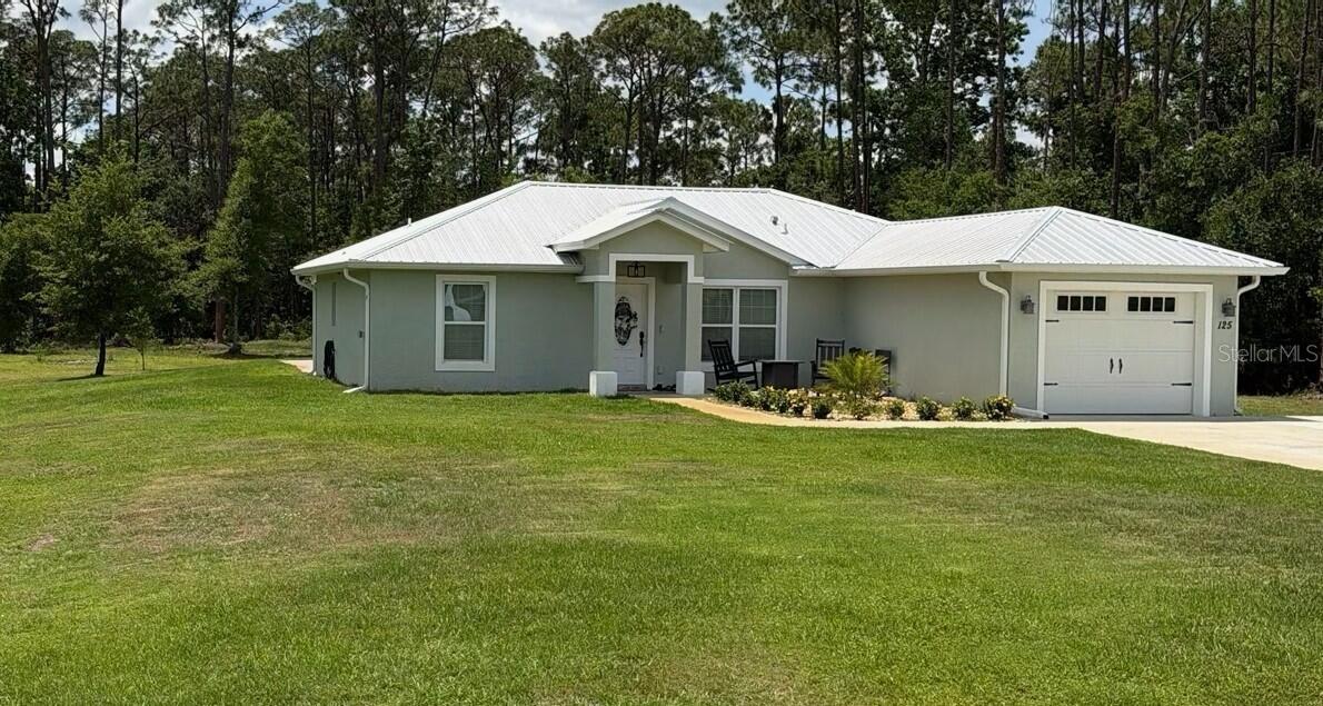 Under Construction. Pre-construction opportunity in beautiful Lake Placid, Florida. Scheduled for completion in 2026, this single-family residence features modern comfort, durable construction, and a spacious lot-making it an ideal choice for buyers seeking long-term value, low-maintenance/energy efficient living, and the benefits of new construction.    This upcoming 3-bedroom, 2-bathroom home features an inviting open-concept living, dining, and kitchen area enhanced by cathedral ceilings, creating an airy, expansive feel the moment you walk in.