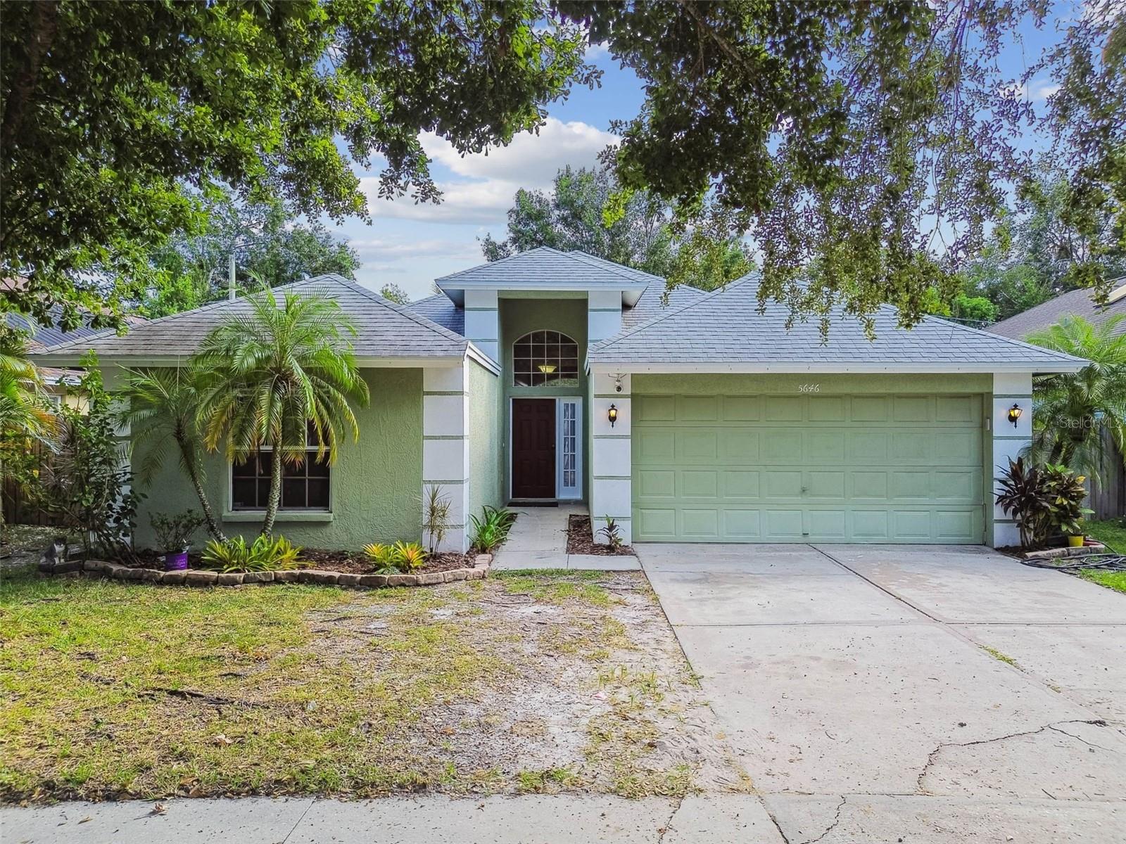 Back on the market with updated flooring throughout the home and a beautiful palm tree in the backyard!
This move-in-ready four-bedroom, two-bath home with a two-car garage is located in the desirable Paddock Trail community of Carrollwood. The well-maintained residence features vaulted ceilings, an open floor plan, and abundant natural light, creating a bright and inviting atmosphere.
The primary suite is privately situated on one side of the home and includes an en-suite bath for added comfort. The kitchen offers granite countertops, an oversized sink, an upgraded faucet, and plenty of workspace for cooking and entertaining. On the opposite side, you’ll find three additional bedrooms with laminate flooring—perfect for family, guests, or a home office.
Step outside to enjoy low-maintenance living with a wood deck and a screened-in patio, ideal for relaxing or entertaining while embracing Florida’s outdoor lifestyle.
Schedule your private showing today and see everything this Carrollwood home has to offer!