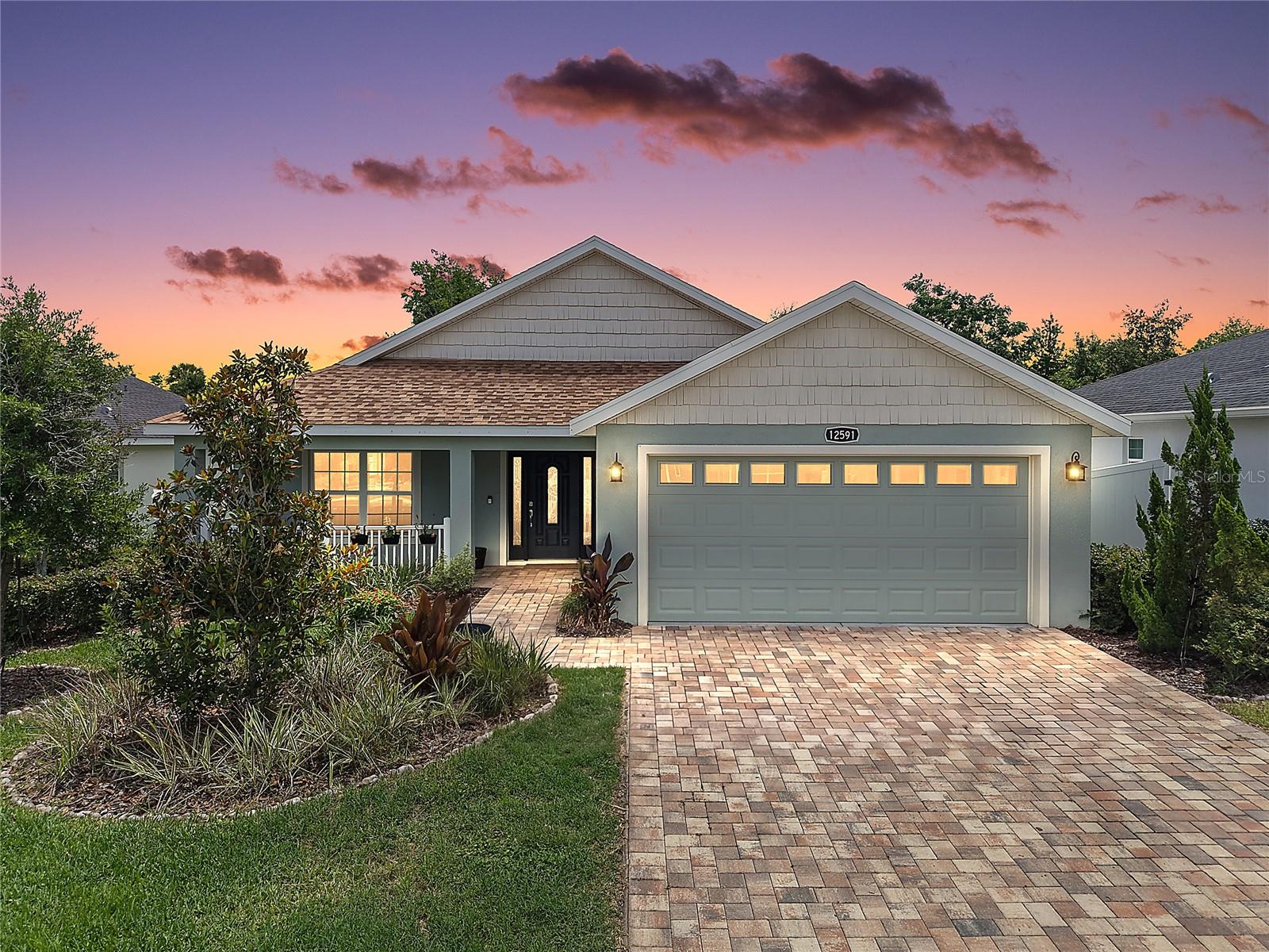 Welcome to this GORGEOUS 3-bedroom, 2-bath home boasting a PRIVATE FENCED YARD with ROOM FOR A POOL in the highly desirable, family-friendly, GATED community of Densan Park! Conveniently located JUST MINUTES from The Villages retirement community, The Villages Charter Schools, and CR466 offering easy access to an abundance of shopping, dining, banking, medical and more! NO BOND and LOW HOA of just $85/monthly. Built in 2022, this nearly new home offers low-maintenance peace of mind with modern design! PAVER drive and walkways, STONE-EDGED landscaping, and a CHARMING front porch create exceptional curb appeal and a warm welcome to this BEAUTIFUL CONTEMPORARY home. An ELEGANT LEADED-GLASS entry door flanked by DOUBLE SIDELIGHTS fills the foyer with natural light, while a convenient ENTRY CLOSET adds everyday functionality. Beyond the entrance, you'll immediately appreciate the BRIGHT, OPEN-CONCEPT design of the living, dining, and kitchen, creating an inviting atmosphere perfect for both relaxing and entertaining. HIGH VAULTED ceilings enhance the sense of openness, while easy-maintenance PLANK TILE flooring runs seamlessly throughout the ENTIRE home adding a sleek, modern touch. The STUNNING kitchen showcases CHERRY SHAKER cabinetry with GLASS accents, GRANITE countertops, STAINLESS appliances, TILE backsplash, built-in WINE RACK, and a CENTER ISLAND with EAT-IN area. From the kitchen, SLIDING GLASS DOORS open to a SPACIOUS REAR PATIO designed for effortless Florida living. Whether you're grilling with friends, enjoying outdoor dining, entertaining guests, or simply unwinding with your morning coffee, this inviting outdoor space offers the perfect setting. The FULLY FENCED BACKYARD boasts ample ROOM FOR A POOL and provides EXCEPTIONAL PRIVACY for pets, children, gardening, or outdoor activities, creating a peaceful and secure retreat where you can enjoy Florida's beautiful weather! Back inside, the primary bedroom features a TRAY ceiling and a WALK-IN CLOSET. Its stylish en-suite bathroom features CHERRY SHAKER cabinetry with GRANITE top, DUAL sinks, TILED WALK-IN shower, and a LINEN closet. Bedrooms two and three each offer large windows and built-in closets. The second bathroom offers a CHERRY SHAKER vanity with GRANITE top and a TILED tub and shower combination. Completing the package is a TWO CAR GARAGE with a convenient laundry closet with shelving, attic access with stairs, and an exterior door to the yard. The Densan Park Community offers an UNBEATABLE LOCATION - only minutes from CR466 and The Villages - and features a large PLAYGROUND with PICNIC AREAS; PICKLE BALL and BASKETBALL COURTS for sports enthusiasts; WALKING TRAILS; and a DOG PARK for your furry friends! DON’T MISS YOUR OPPORTUNITY TO MAKE THIS INCREDIBLE HOME YOUR OWN! Please watch our walkthrough video and call today to schedule your Private Showing or Virtual Tour!