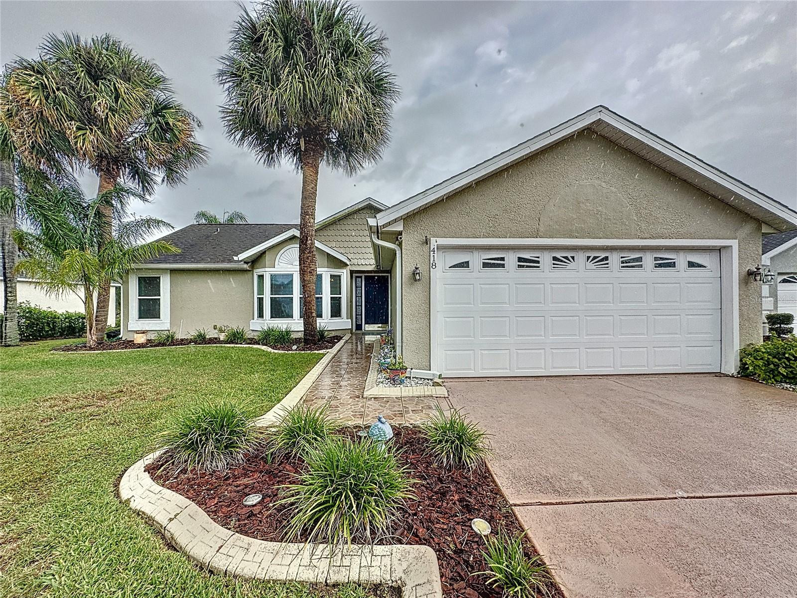 Presenting 418 Hanging Moss Rd - This charming 3 bedroom, 2 bath POOL home is located in a popular LOW HOA community ($195 per Annum). There are lots of special touches in this home to enjoy! New laminate flooring in master bedroom and spare bedroom turned office with tile throughout the rest of the home. Home has been painted throughout with fresh contemporary colors. Vaulted ceilings & lots of light make the living, dining, and kitchen feel open and welcoming! There is a charming breakfast nook in the kitchen that can also be used as a work from home space, enjoyng beautiful views of the pool and backyard. This home features a wonderful split floorplan to maximize privacy and really utilize the square footage. Tile walkway to front door, irrigation, newer windows, newer HVAC system! Roof was replaced in 2015. Two car garage and long driveway make parking multiple vehicles  breeze. Enjoy the large, fully fenced in backyard. The landscaping to the front of the home is low maintenance. Sunridge Woods is located just off Ronald Reagan Parkway and is a short drive from shopping & dining at Championsgate & Posner Park village and is prefectly placed for Disney, the attractions area and everything central Florida has to offer. For golfing enthusiasts, the home is close to the championship courses at Reunion and Providence. Don't miss your opportunity to see the benefits of this home for yourself, make your appointment TODAY!
<iframe width="560" height="315" src="https://www.youtube.com/embed/MM6uKi9fnu8?si=1rz7ZQnFyWIiGtoq" title="YouTube video player" frameborder="0" allow="accelerometer; autoplay; clipboard-write; encrypted-media; gyroscope; picture-in-picture; web-share" allowfullscreen></iframe>
