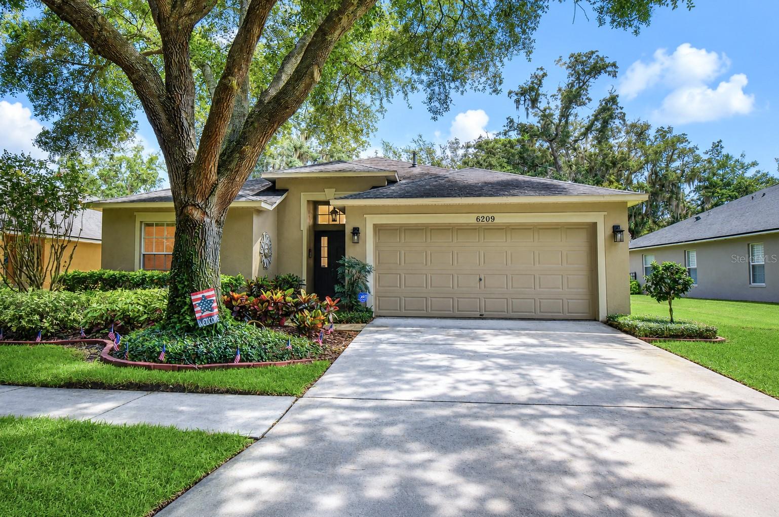 Perfectly situated in the highly sought-after FishHawk Ranch community, this beautifully maintained 4-bedroom, 2-bath home combines a thoughtfully designed floor plan with the exceptional lifestyle that has made FishHawk one of Tampa Bay's premier communities. Featuring a spacious open-concept layout and a highly desirable triple split-bedroom floor plan, this home offers the perfect balance of open gathering spaces and private retreats for family and guests alike. The expansive living areas flow effortlessly together, creating an inviting setting for both everyday living and entertaining. Large sliding glass doors fill the home with natural light and create a seamless connection to the outdoor living space, while fresh interior paint completed in 2026 gives the home a crisp, move-in-ready feel. The spacious primary suite features dual walk-in closets and a private en-suite bath with dual vanities, a relaxing soaking tub, and a separate shower. Two secondary bedrooms are tucked away on their own private wing with a full bath, while the fourth bedroom offers exceptional flexibility as a guest suite, home office, or hobby room. Step outside to the extended screened lanai overlooking a beautifully landscaped, fully fenced backyard—an ideal space for morning coffee, weekend barbecues, or simply unwinding while enjoying Florida's year-round sunshine. With plenty of room for pets, play, or gardening, the backyard is designed to be enjoyed. Major improvements have already been completed, including a new roof in 2020, a new air conditioning system in 2022, and fresh interior paint in 2026, offering peace of mind and lasting value. Living in FishHawk Ranch means enjoying an unparalleled amenity-rich lifestyle with resort-style aquatic centers, miles of scenic walking and biking trails, fitness centers, playgrounds, sports courts, dog parks, and year-round community events. Located within an award-winning school district and just minutes from shopping, dining, and everyday conveniences, this home offers the opportunity to enjoy one of the most sought-after lifestyles in the Tampa Bay area.