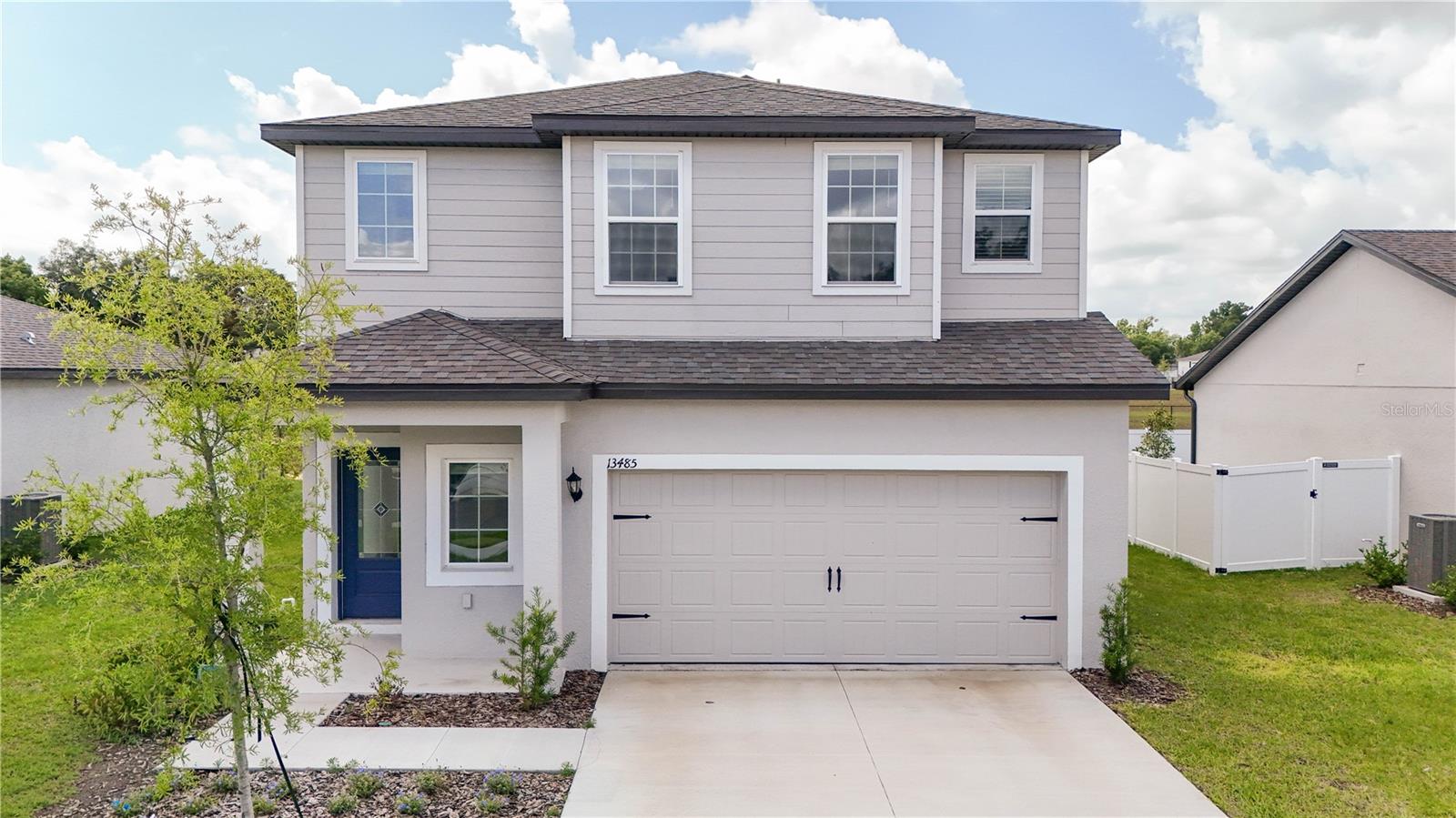 Welcome to the Driftwood plan in the desirable Tula Parc community in Astatula! This beautifully designed home offers exceptional curb appeal with professionally landscaped front yard and a thoughtfully crafted open-concept layout perfect for modern living. The chef-ready kitchen serves as the heart of the home, featuring granite countertops, 36” upper wood cabinets with crown molding, Moen® faucets, and a full suite of energy-efficient Whirlpool® appliances, including refrigerator, stove, microwave, and dishwasher. The kitchen seamlessly flows into the spacious dining and family rooms, creating an ideal setting for entertaining and everyday living. Enjoy indoor-outdoor living with a covered back patio, perfect for gatherings or relaxing evenings. The private primary suite is filled with natural light and includes a spacious walk-in closet and an en-suite bathroom with double-sink vanity and step-in shower. Located near Little Lake Harris, Tula Parc offers a tranquil setting with convenient access to outdoor recreation, including boating, fishing, hiking, and golf. Don’t miss this opportunity to own a beautifully upgraded home in a growing community!