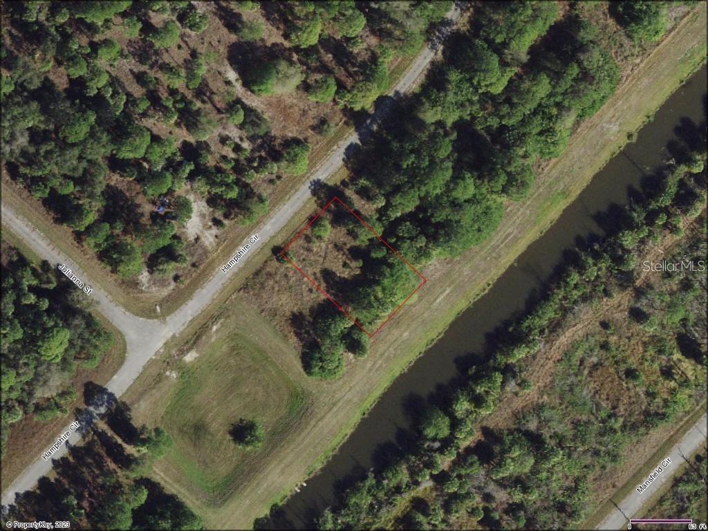 This spacious, buildable 1/4-acre lot is located on an active canal within the recently rezoned AC-10 area at the southeast corner of North Port. The AC-10 zoning supports commercial, industrial, and multi-family developments, encouraging the growth of self-sustaining "live, work, play" communities. The property is conveniently positioned within close proximity to the Atlanta Braves Spring Training Baseball Stadium, North Port New Aquatic Center, Historic Warm Mineral Springs, numerous shopping and dining options, as well as several Southwest Florida Gulf Coast Beaches. It is also near North Port's future I-75 Interchange Exit Ramp Project, ensuring easy access north to Sarasota and Tampa or south to historic Punta Gorda and Fort Myers. Seller financing is available at competitive rates and terms.