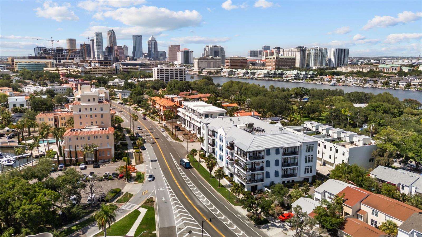 Welcome to island living in the heart of Davis Islands — one of South Tampa’s most sought-after waterfront communities known for its walkable charm, vibrant local scene, and relaxed coastal atmosphere. Ideally situated just moments from the shops, restaurants, and cafés of Davis Islands Village, this beautifully appointed 3-bedroom, 3.5-bathroom condo offers the perfect blend of luxury and lifestyle. Inside, the open and bright floor plan is filled with an abundance of natural light, creating an inviting space ideal for both everyday living and entertaining. The spacious kitchen serves as the heart of the home, featuring an oversized island, generous counter and cabinet space, and a stylish wet bar perfect for hosting guests. Each of the three bedrooms offers its own en-suite bathroom, providing comfort and privacy throughout. One of only three residences in the exclusive 11-unit building to feature three true en-suite bedrooms, this unique floor plan offers a rare level of convenience and flexibility for both owners and guests. Outdoor living is seamlessly woven into the home with multiple balcony spaces designed to enjoy the island breeze. A spacious balcony accessible from both the main living area and the primary suite extends the living space outdoors, creating the perfect setting for morning coffee or evening relaxation. The secondary bedrooms share an additional balcony, offering yet another place to relax and take in the charm of this exceptional neighborhood. Additional conveniences include a dedicated Tesla charging station located in one of the unit’s assigned parking spaces. From waterfront sunsets and yacht club weekends to morning coffee in the Village and scenic golf cart rides around the islands, this is more than just a home — it’s the quintessential Davis Islands lifestyle.