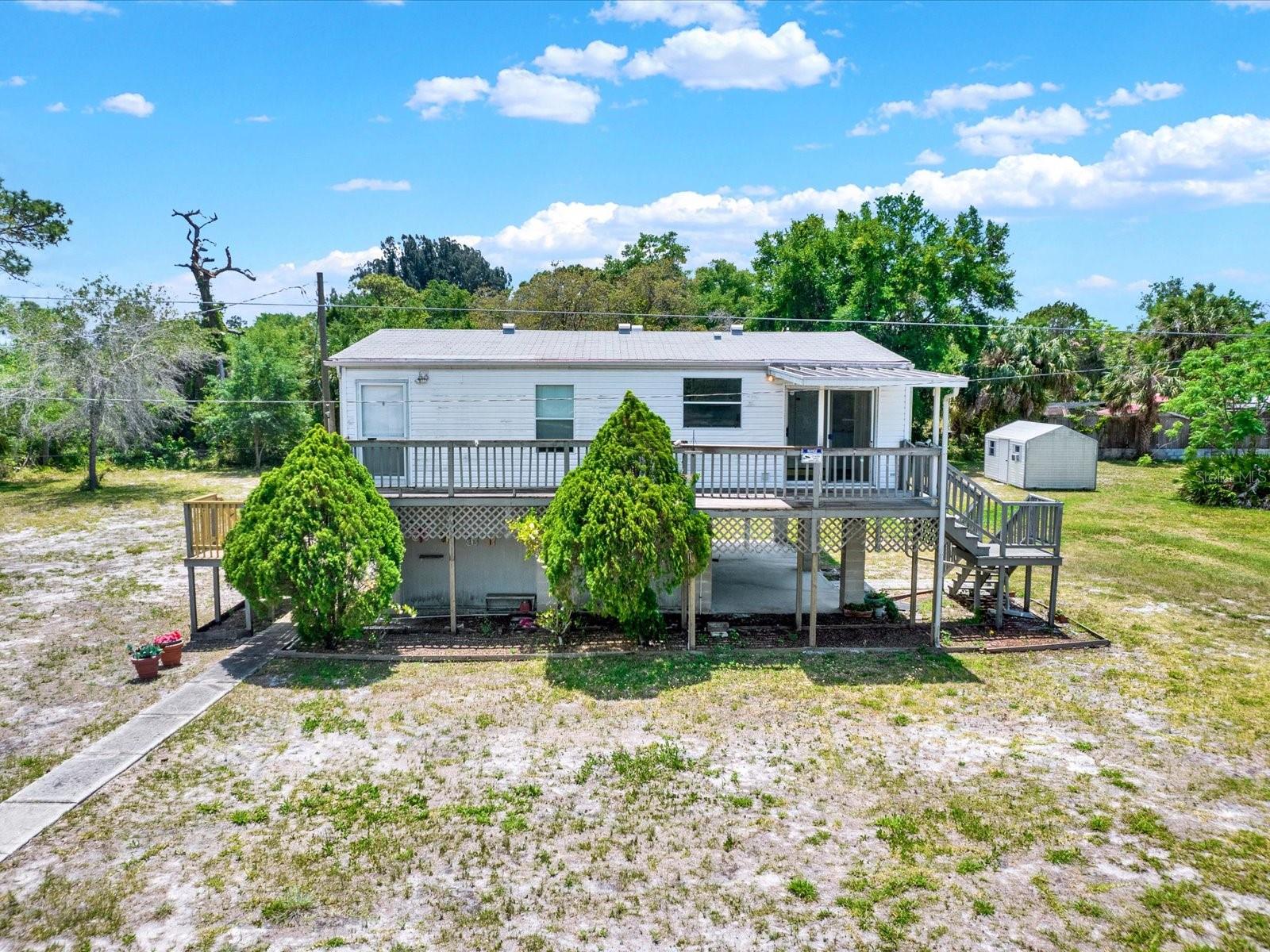 Move-In Ready Stilt Home on .40 Acres in Hudson, FL – Loaded with Updates! Discover the perfect blend of comfort, privacy, and Florida living in this beautifully updated 2-bedroom, 2-bathroom stilt home offering 972 sq. ft. of living space on an oversized 0.40-acre lot. This move-in-ready home features new flooring, new appliances, a new hot water tank, updated plumbing, and a brand-new septic system, providing peace of mind for years to come. The bright, open floor plan creates a welcoming space for everyday living and entertaining. Step outside to enjoy the expansive backyard with plenty of room for family gatherings, pets, gardening, or storing your boat, RV, or recreational toys. A large detached shed with electricity and A/C is perfect for a workshop, home office, hobby room, or studio, while an additional storage area beneath the home provides even more space for your belongings. Conveniently located near shopping, dining, schools, parks, marinas, and the Gulf Coast, this property offers easy access to everything Hudson. Whether you're searching for a full-time residence, vacation home, or investment property, this updated home is priced to sell. Schedule your private showing today before this incredible opportunity is gone!