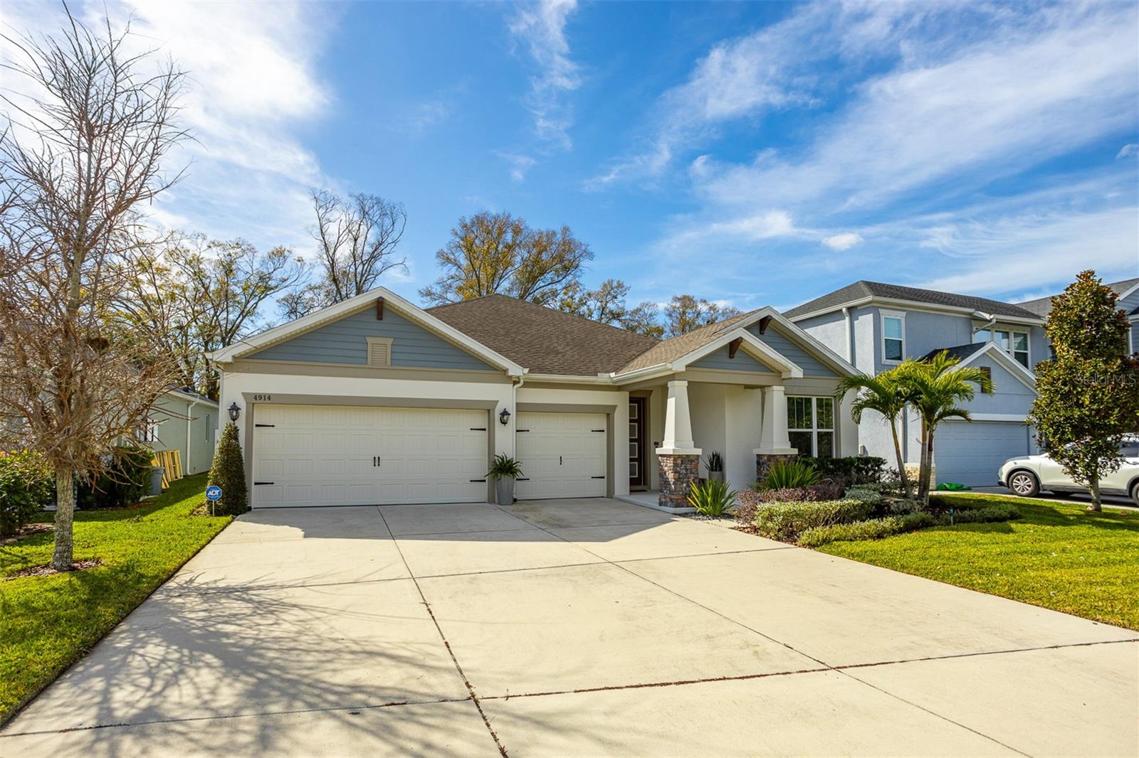 Nestled within the intimate enclave of Lakeshore Oaks in the highly sought-after David Weekley home offers a rare blend of thoughtful design, modern comfort, and timeless style. Ideally located just off Lakeshore Road, residents enjoy convenient access to the Veterans Expressway, Dale Mabry Highway, and the top-rated Steinbrenner High School. This spacious single-story residence was designed with both functionality and elegance in mind, featuring four generously sized bedrooms, a dedicated study, and a three-car garage. The split-bedroom layout provides privacy and flexibility, while the open-concept living spaces create an effortless flow perfect for both everyday living and entertaining. At the heart of the home, the kitchen delivers a warm yet refined aesthetic, complete with a stainless farmhouse sink, statement vent hood, and beautifully crafted painted wood cabinetry with soft-close features. Overlooking the expansive backyard, it’s a space where gathering, cooking, and connection come naturally. The owner’s retreat serves as a private sanctuary, highlighted by a tray ceiling, a spa-inspired elongated walk-in shower, and dual vanities adorned with elegant quartz countertops. Every detail has been carefully curated to offer both comfort and sophistication. This home is filled with an abundance of natural light thanks to oversized windows and features a highly livable, well-balanced floor plan. Built with energy efficiency in mind, it offers long-term savings and enhanced comfort for years to come. Lakeshore Oaks presents a rare opportunity to enjoy a boutique community setting paired with exceptional convenience, top-tier schools, and a home that truly lives as beautifully as it looks. Call today to schedule your private showing!