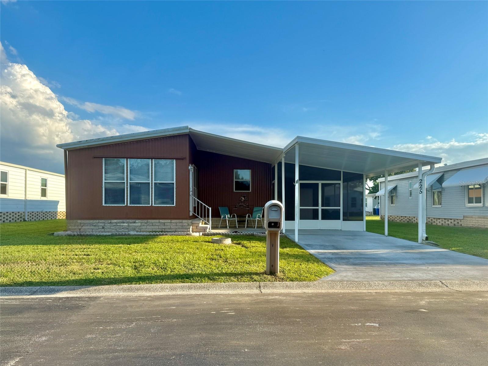 This very affordable two bedroom, two bathroom home is located in Caribbean Isles Residential Cooperative and offers the perfect setting for those beginning retirement or looking for a warm and welcoming winter retreat. With no lot rent and no CDD, and a low monthly maintenance fee, you can enjoy the comfort of ownership without the burden of high carrying costs. The primary bedroom features an ensuite bath, while a second full bathroom off the hall provides convenience for visiting family and friends. Sliding glass doors from the living room open to a fully enclosed sunporch, creating additional living space that can be used year round as a cozy den, home office, reading room, or extra sleeping area for guests. The home is partially furnished, making it easy to settle in and start enjoying the Florida lifestyle right away. Just outside the kitchen is a screened lanai, a comfortable place to enjoy your morning coffee or unwind in the evening while greeting neighbors as they stroll by on golf carts, bicycles, or walking their pets. With four miles of private roads, you can take daily walks to the clubhouse, heated pool, or lagoon park while staying active and connected. Caribbean Isles is a resident owned 55+ waterfront community designed for relaxed living, offering a clubhouse with regular social events and activities, a heated pool for year round enjoyment, shuffleboard and bocce courts, a dog park, RV and boat storage, and a private boat and kayak launch with direct access to Tampa Bay for those who enjoy time on the water. Located in Apollo Beach, the community provides convenient access to shopping, dining, medical facilities, and major highways for easy travel to Tampa, St. Petersburg, and Sarasota. This home presents an opportunity to enjoy a simpler pace, warmer winters, and a friendly, established community where neighbors become friends.