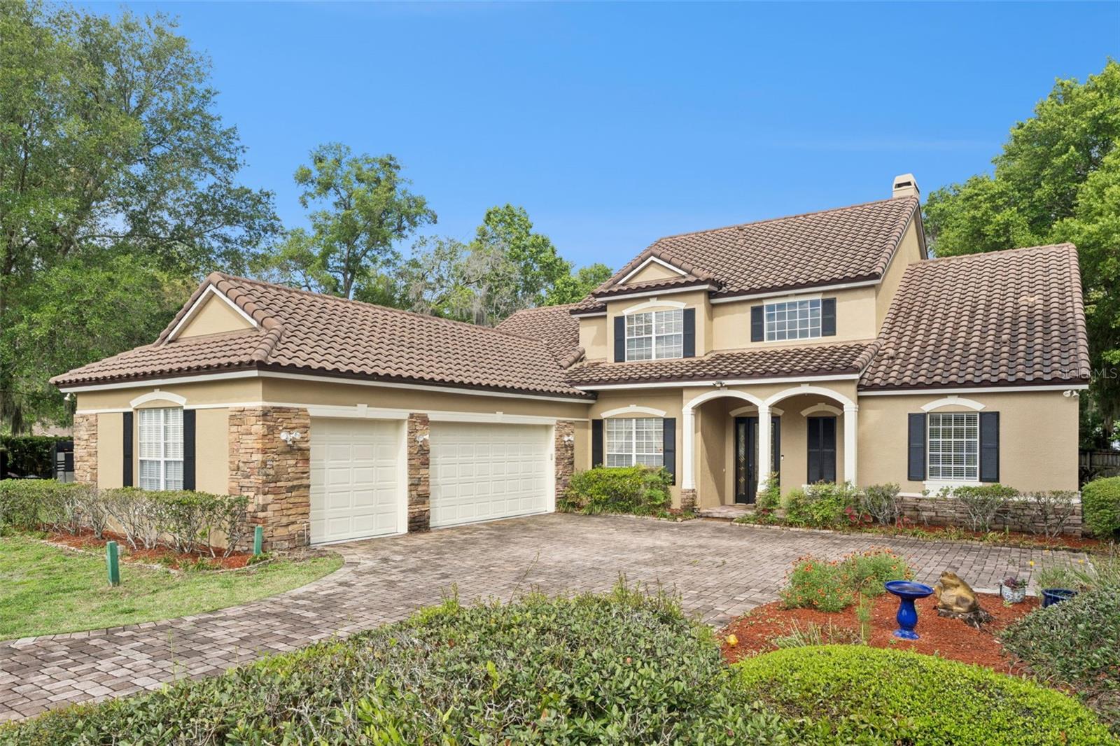 Centered around a stunning lagoon-style pool and spa, this 6-bedroom, 3.5-bath residence lives like a private retreat, perfect for those who appreciate nature, privacy, and effortless indoor-outdoor living. Set on a spacious lot and surrounded by natural, lush landscaping, the backyard feels like a secluded escape. Natural contours and tranquil water features create a peaceful oasis where you can unwind, entertain, or simply enjoy the outdoors. With multiple rooms offering direct access outside, the home seamlessly blends interior comfort with its natural surroundings. Inside, natural light pours through expansive windows, illuminating rich hand-scraped hardwood floors and highlighting the home’s distinctive architectural character, including coffered ceilings and archways that add depth and visual interest throughout. The open-concept layout connects the living, dining, and kitchen areas, creating a space that flows effortlessly for both everyday living and entertaining, all while staying visually connected to the outdoors. The split floorplan offers added privacy, with the primary suite serving as its own serene sanctuary. Enjoy direct pool access, a spacious primary bath with dual vanities and a walk-in shower, along with two walk-in closets, designed for both comfort and functionality. Upstairs, a versatile loft opens to a private balcony overlooking the pool and lush backyard, an ideal setting for morning coffee or unwinding at sunset. This level also includes a dedicated office and additional bedrooms, offering flexibility for guests, work, or hobbies. Thoughtfully maintained and updated, the home features a tile roof (2021), fresh exterior paint (2026), updated pool equipment (2021), and a newer hot water heater (2025), providing both peace of mind and lasting value. Ideally located in a quiet, well-established neighborhood in Sanford, this home offers the perfect balance of privacy and convenience. Just minutes from I-4 and 417, you’ll enjoy easy access to surrounding areas. Nearby parks, scenic trails, and waterways like Lake Monroe and the Wekiva River provide endless opportunities for outdoor recreation, while local dining, shopping, and the charm of historic downtown Sanford are all within close reach. Blending natural beauty, thoughtful design, and a true sense of escape, this home offers a rare opportunity to experience a nature-inspired lifestyle every day.