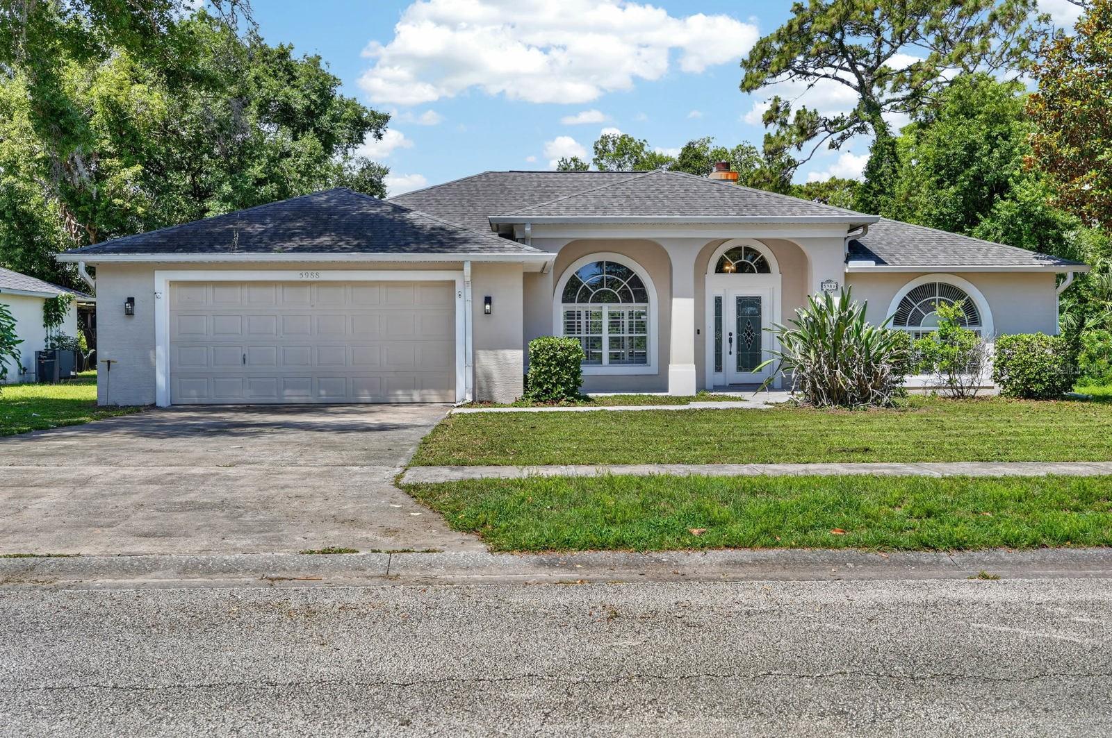 Welcome to your private Port Orange retreat - where comfort, convenience, and peace of mind come together. This well-maintained home offers a desirable split floorplan, giving everyone their own space while still feeling connected. The heart of the home is anchored by a cozy fireplace that can be enjoyed as both gas and electric. The primary suite is a true escape, complete with custom built-in shelving and a spacious bathroom featuring a beautifully tiled walk-in shower. A versatile bonus room offers the perfect space for a home office, playroom, gym, guest space, or additional flex area to fit your lifestyle. Step outside and you'll immediately see where this home really shines a stunning, well-maintained pool and expansive back patio designed for entertaining or simply unwinding at the end of the day. The perfect canvas to finish in a way that fits your style! With a lush preserve directly behind the home, you'll enjoy rare privacy and peaceful views year-round. Practical upgrades add even more value, including a new irrigation system and automatic garage door system. The home is equipped with a dedicated RV electrical hookup, providing convenient on-site power for your RV, camper, or travel trailer. This property also benefits from a unique advantage-being located on the hospital power grid, offering a significantly reduced likelihood of power outages during major storms. Even better, the adjacent lot features a flood-deterring retention pond, providing added protection and contributing to the home's no history of flooding. Sawgrass Point also offers residents private access to a boat launch and scenic waterfront park along Spruce Creek, ideal for relaxing and fishing. Location is the final piece that ties it all together-just a short, under 10-minute drive to I-95, making commuting and travel quick and convenient while still enjoying a quiet, tucked-away neighborhood feel. The home received a new roof in 2018, a new AC in 2015, and a new hot water heater in 2019. This is the kind of home that checks boxes you didn't even know you had.