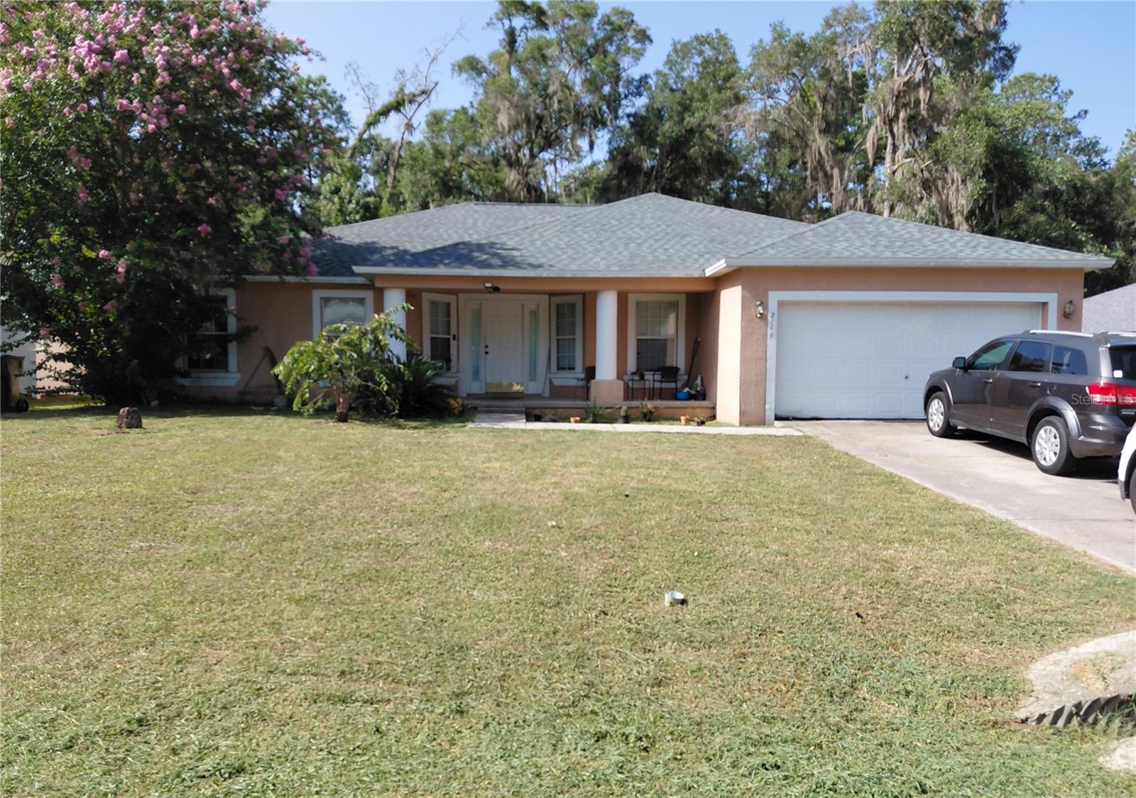 Welcome home to this large 4-bedroom, 2-bathroom home offering 2,239 square feet of comfortable living space in highly desirable Raven Glen community of Northeast Ocala. This charming home combines space, functionality, and outstanding value without a HOA! Step inside to discover a split floor plan featuring tall ceilings, and multiple living spaces designed to fit today's lifestyle. The flexible layout includes a spacious family room, separate dining room, kitchen nook, and an additional office, den, or hobby room to suit your needs. The spacious kitchen offers abundant cabinet and countertop space, a large pantry, refrigerator, range, microwave, and is perfectly positioned between the casual breakfast area and formal dining room, making entertaining a breeze. The desirable split-bedroom floor plan provides added privacy. The primary suite is tucked away from the secondary bedrooms and features a generous walk-in closet, relaxing soaking tub and a separate shower. Step outside and enjoy Florida living on the covered back porch great for gatherings, or simply relaxing outdoors. Major improvements include a brand-new roof in 2025 and a brand-new complete AC system 2026, giving buyers added peace of mind. Conveniently located just minutes to shopping, restaurants, schools, medical facilities, and just minutes to historic Downtown Ocala, you'll enjoy both convenience and a peaceful neighborhood setting. Whether you're searching for the perfect family home or an excellent investment property, this spacious Raven Glen home is a must see! All showings require a 24-hour notice. Schedule your private showing today before this home is sold!