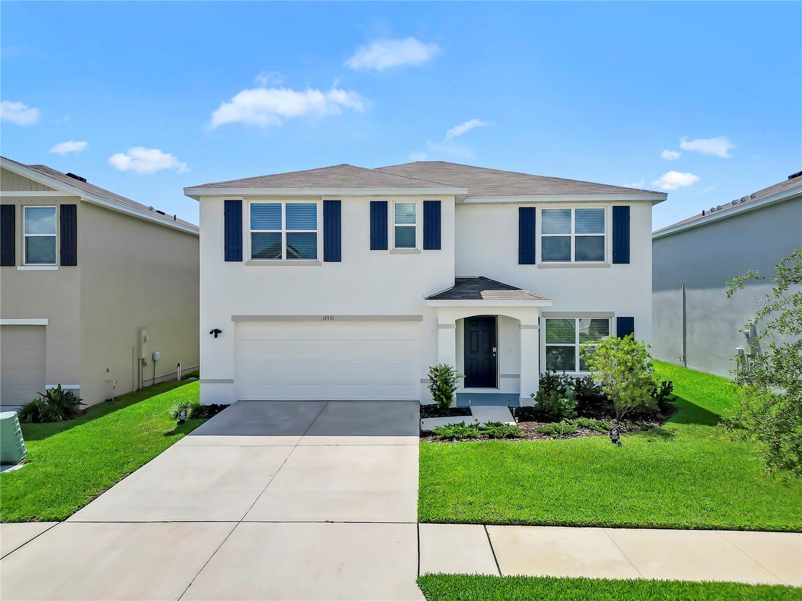 Welcome to this spacious and beautifully designed 5-bedroom, 3-bathroom home offering over 2,600 square feet of comfortable living space in the heart of Wimauma. Featuring a highly desirable open-concept layout, this two-story home is thoughtfully designed for both everyday living and entertaining. The modern kitchen overlooks the dining and great room areas, complete with a large island, abundant cabinetry, and seamless flow to the outdoor living space. The home layout appears consistent with a 5-bedroom, 3-bath floor plan of approximately 2,600 sq ft.

The first floor features a versatile flex room near the entry, ideal for a home office, playroom, formal sitting area, or homeschool space, along with a downstairs bedroom and full bath—perfect for guests or multi-generational living. Upstairs, you'll find a spacious primary suite with dual walk-in closets and a private ensuite bath, plus three additional bedrooms, a bonus loft area, and convenient second-floor laundry. Similar nearby homes on Logan Cave Ave feature this spacious two-story design with bonus/loft space and attached 2-car garages.

Step outside to enjoy the Beautiful backyard, creating a peaceful retreat ideal for entertaining, pets, play, or relaxing evenings. The home also includes a 2-car garage and functional indoor/outdoor living spaces designed to fit today’s lifestyle. Nearby comparable homes emphasize private fenced yards and community convenience in this area.

Conveniently located near major roadways, shopping, dining, and community amenities, this home offers the perfect blend of space, flexibility.