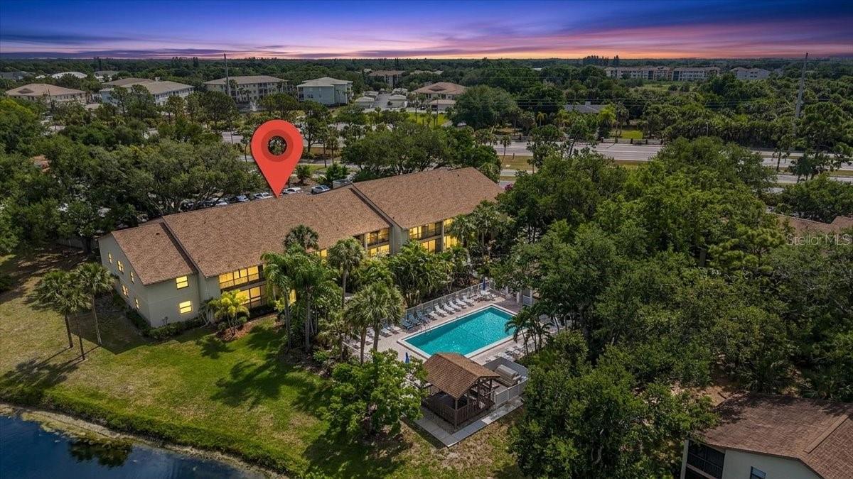 Enjoy the best of Venice living in this charming Bird Bay Village retreat, perfectly positioned just minutes from pristine Gulf beaches. This two-bedroom, two-bathroom residence offers a cozy and traditional layout, featuring a separated kitchen that remains connected to the dining area via a convenient breakfast bar opening. The intimate living room is highlighted by dramatic vaulted ceilings and large sliders that lead out to a spacious screened lanai—the perfect spot to enjoy the Florida weather year-round. Because the windows are north-facing, the home enjoys soft, consistent natural light throughout the day without the intense heat of the direct sun. The community pool right in your backyard, a short walk away!

The primary suite serves as a private sanctuary with a walk-in closet, ensuite bath, and its own private balcony. Guests will feel right at home in the second bedroom, which is situated directly across from a full bath. Outside your door, Bird Bay Village offers a resort-style lifestyle with pool, tennis and pickleball courts, a fitness center, and immediate access to the Legacy Trail. Located just off the island and close to the boutique shopping of historic West Venice Avenue, this unit is a wonderful opportunity for an active coastal lifestyle.