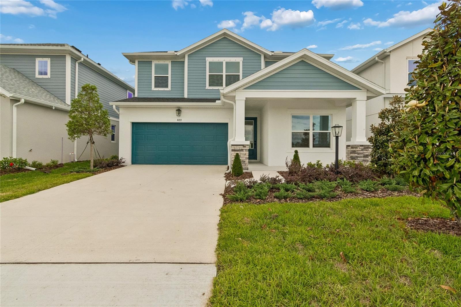 Discover the Bradson by David Weekley Homes at Eastlyn in Bradenton, FL. Just minutes from I-75, this beautifully designed two-story home offers the perfect balance of thoughtful design and everyday comfort. Located in a no CDD fee community, Eastlyn provides a peaceful neighborhood setting that feels tucked away, yet remains conveniently close to major roadways for easy commuting and daily errands. This spacious floor plan offers 2,719 square feet of living space with 4 bedrooms, 3 bathrooms, and an enclosed study with elegant French doors—ideal for a home office, creative space, or quiet retreat. A versatile upstairs retreat adds additional flexibility and can be used as a media room, playroom, or second living area. Every Bradson home is backed by David Weekley Homes’ comprehensive 1-2-10 Builder’s Warranty, providing confidence and long-term peace of mind. The open-concept kitchen is the heart of the home, featuring a large solid-surface island and showcasing David Weekley Homes’ signature long sight lines that flow seamlessly into the dining and family rooms—perfect for entertaining or relaxing. Beautiful laminate flooring throughout the first floor and 8-foot interior doors enhance the home’s light-filled, airy feel and elevate the overall sense of style. Upstairs, the Owner’s Retreat offers a private escape, complete with a spa-inspired en suite bath featuring a luxurious Super Shower. Step outside to a generous covered lanai that extends the living space outdoors, making it the perfect spot for morning coffee, casual dining, or gathering with friends under the Florida sky.