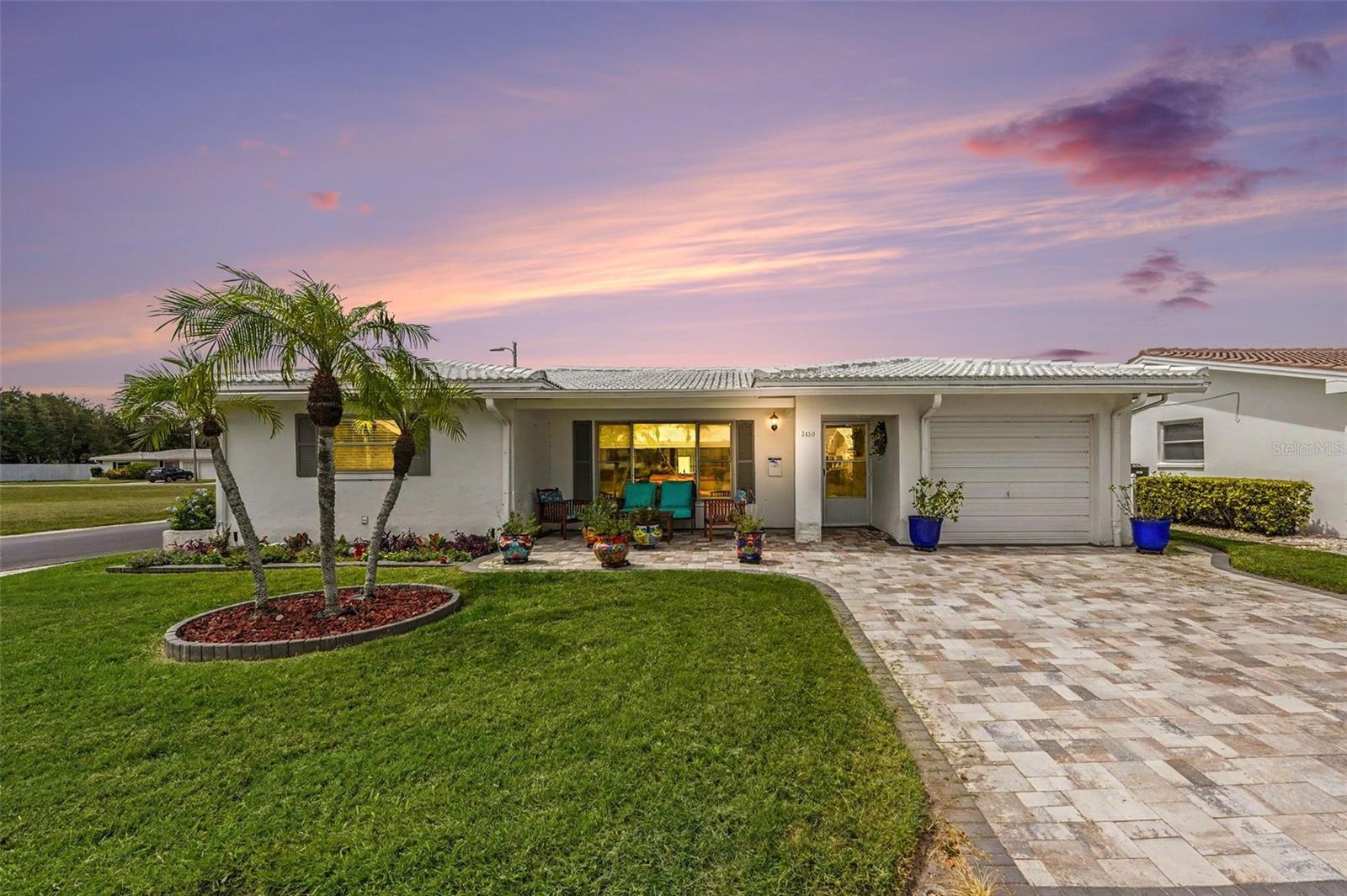 LOCATION, LOCATION, LOCATION! This exceptional 2-bedroom, 2-bath, 1-car garage home with a versatile office/flex room is one of the most thoughtfully updated homes in The Mainlands. Designed for today's lifestyle, the completely open-concept Great Room seamlessly combines the living room, dining area, and beautifully remodeled kitchen into one bright, inviting space that's perfect for entertaining or everyday living. The bonus room, complete with elegant double French pocket doors, offers endless flexibility as a home office, guest room, craft room, or den.

The stunning, light-filled kitchen has been completely redesigned with custom cabinetry, a center island, granite countertops, stainless steel appliances, soft-close drawers and doors, and abundant storage. Luxury vinyl plank flooring flows throughout the main living areas, complemented by tile flooring in both beautifully remodeled bathrooms and upgraded tall baseboards throughout the home. The spacious primary suite features a beautifully updated bath with dual vanities, a walk-in shower, and contemporary illuminated mirrors.

Additional improvements include fresh interior paint, new lighting throughout, an indoor laundry room, most windows replaced, and a newer hot water heater. The roof was replaced in 2018, with the replacement and qualifying roof repairs covered by the association, providing added peace of mind.

Located in the highly desirable golf community of The Mainlands, residents enjoy a golf cart-friendly lifestyle with easy access to the community golf course, clubhouse, and neighborhood amenities. Conveniently situated near shopping, dining, beautiful Gulf beaches, and both Tampa International and St. Pete-Clearwater airports, this truly move-in-ready home offers the perfect blend of style, function, and carefree Florida living. Opportunities like this don't come along often—schedule your private showing today!