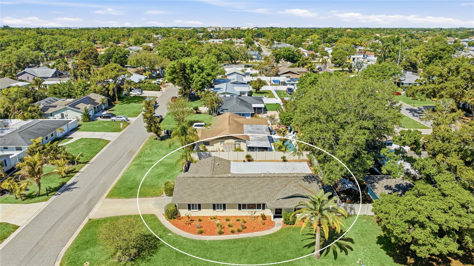 Welcome to this 3-bedroom, 2-bathroom home in Northwest Bradenton, just minutes from Anna Maria Island and Robinson Preserve. Situated on a spacious corner lot in a quiet, established neighborhood, this property offers privacy with a fenced backyard, along with the benefit of no HOA restrictions. Recent updates include a newer roof and a 2024-installed AC, offering added peace of mind for the next owner. Inside, the home features a functional layout with both a living room and a family room, providing multiple spaces for relaxing or entertaining. The kitchen is centrally located and thoughtfully designed with ample cabinet storage and a breakfast bar that adds both function and casual seating. Privately positioned, the primary suite serves as a comfortable retreat with its own en suite bathroom and walk-in closet. Two additional bedrooms and a guest bath provide flexibility for family, visitors, or a dedicated office space. Designed to embrace Florida living, the outdoor space features a screened lanai overlooking the sparkling private pool and fenced backyard. The yard is clean, manageable, and offers additional space for grilling, gardening, or simply enjoying the outdoors in a private setting. Conveniently located near shopping, dining, and beaches, this home offers a great combination of location and flexibility.