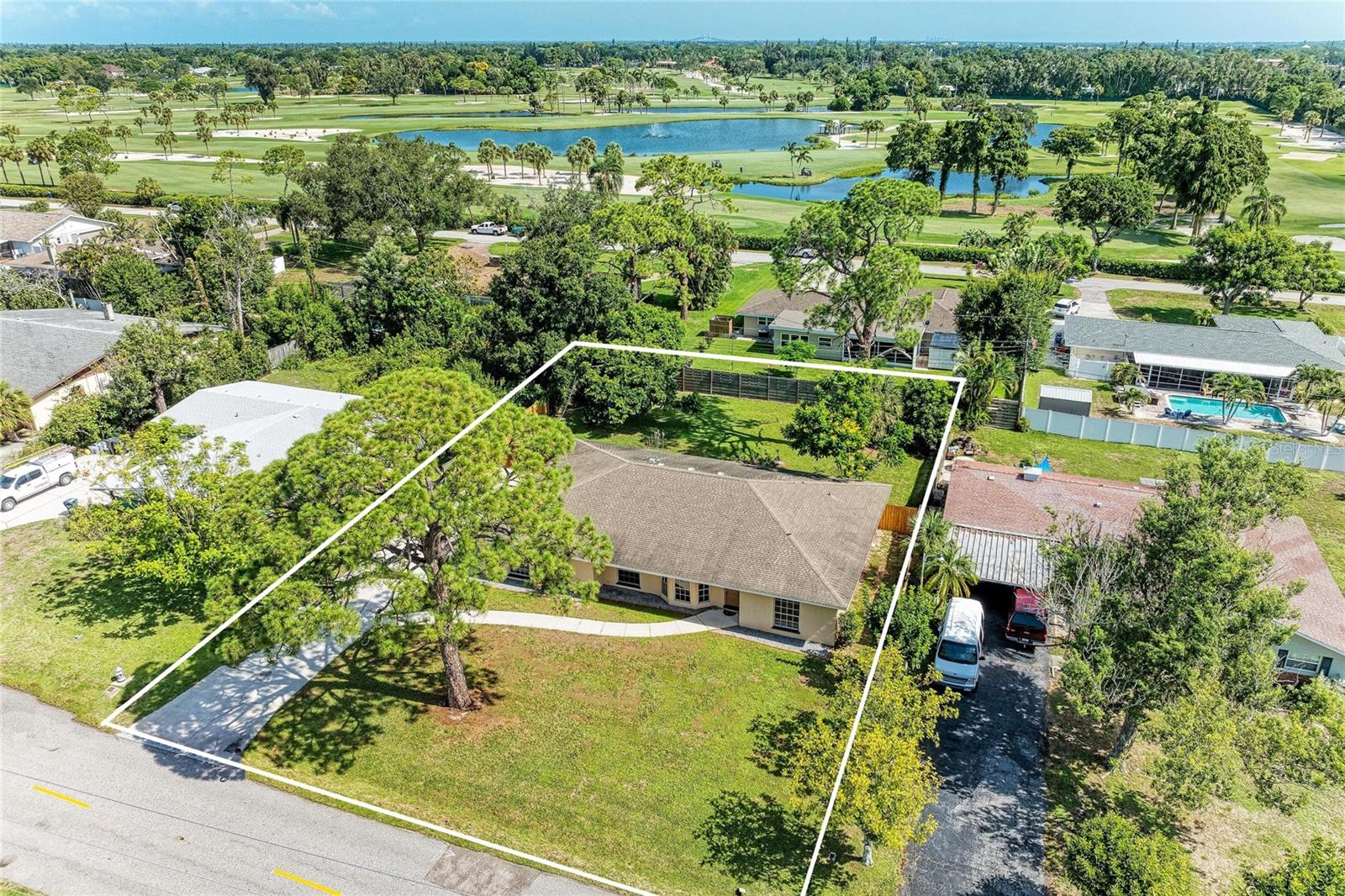 LOCATION, LOCATION, LOCATION...The ONLY thing that can't be changed when you buy a home and this one HAS IT! Walking distance to the Bradenton Golf and Country Club, perfect for the avid golfer in your family, less than a mile from two Private Preparatory Schools ideal for training up your children and giving them a head start in life. But what about the beach you might be thinking...it is Florida after all...a short 15 minute drive will get you to the Sunny Shores of the Gulf where you can enjoy a stroll on sandy beaches, delight in gentle ocean breezes and be Wowed by Spectacular Sunsets nightly. So check the box for location...what about the home you ask...Does 4 bedrooms and 3 baths sound interesting? OR are you looking for a Mother-In-Law suite? What about a BIG yard for kids and dogs? Check those boxes too. The In-Law suite features an ensuite bath and a private entrance, the yard is fenced and ideal for a swing set or a dog run and there's definitely ROOM FOR A POOL. The family wing features a Primary bedroom with private bath and two very large additional bedrooms that share a bath. The dining area is great for family gatherings or parties with friends. There is a Florida room that could be a den, craft room, Home Office or a family room. This one needs a few updates but that allows you to make it suited to your taste exactly. The oversized two car garage is large enough for a work bench and there is an indoor laundry room. There's room to park an RV or BOAT with easy access to the street, two newer AC systems to keep electric bills at a minimum and an updated garage door to keep your insurance agent happy. This one is ready for immediate occupancy so call today, you'll be Glad you did!