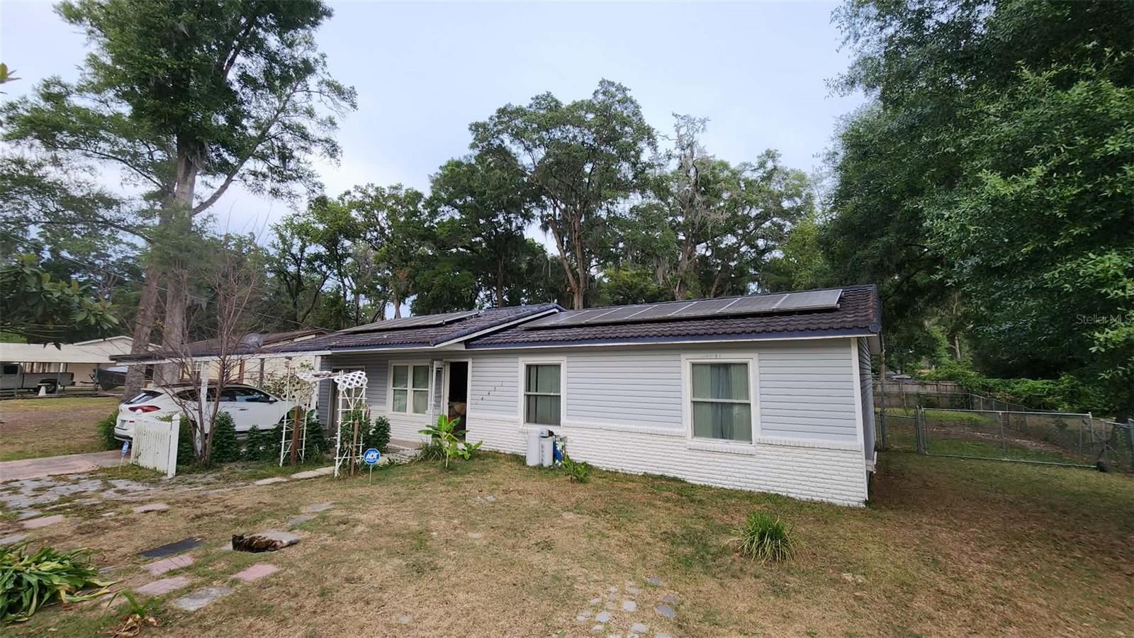 Welcome to 14451 SE 45th Ct in Summerfield — a property full of potential situated on an oversized lot with plenty of room to spread out and enjoy. This home already features several valuable updates including a newer roof, new windows, solar panels for added energy efficiency, and an updated bathroom. With just a little TLC, this property could truly shine and become the perfect opportunity for a homeowner or investor alike. Conveniently located with easy access to I-75, shopping, dining, medical facilities, golf courses, and The Villages, you’ll enjoy both convenience and everyday amenities just minutes away. This is your chance to add your personal touch and create something special.