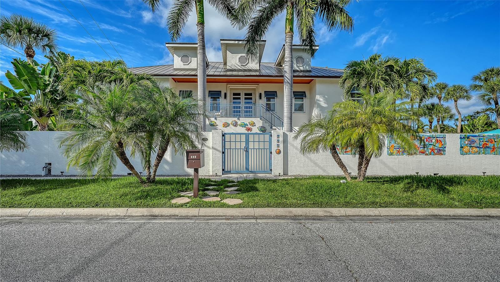 Experience refined coastal luxury in the heart of St. Armands Circle, Sarasota’s premier destination for upscale living, shopping, and dining. This exceptional opportunity offers a fully turnkey, furnished coastal residence located directly on St. Armands Circle and just a short stroll to the white sands of Lido Beach. With estimated rental potential of approximately $1,100 per night or $33,000 per month, this property provides outstanding flexibility for both personal enjoyment and income generation.

This spacious 4-bedroom, 3.5-bath residence has been extensively renovated and thoughtfully updated throughout. Impact-rated windows and doors, a new roof with skylights, updated HVAC systems, and new flooring create a seamless move-in-ready experience. The chef’s kitchen showcases premium Wolf, Sub-Zero, and Bosch appliances, complemented by quartz countertops and custom cabinetry.

The thoughtfully redesigned first level features expansive porcelain tile flooring, spacious living and guest areas, and a beautifully updated guest bathroom with a floating vanity and spa-inspired shower. Outdoors, a fully renovated pool with travertine decking and lush landscaping creates a private tropical retreat.

Recent upgrades throughout the home reflect meticulous attention to detail, including remodeled bathrooms, upgraded lighting and ceiling fans, modern fencing, copper gutters, a striking front entry, and a custom privacy wall featuring ceramic artwork by a celebrated Florida artist.

Just steps from the beach and moments from world-class dining and shopping, this is a rare opportunity to own a fully modernized, income-producing coastal residence in one of Sarasota’s most iconic locations.

Please note: The pool table and monkey lamp are excluded from the sale and will not convey with the property.

Welcome to elevated island living at 345 Madison Drive.