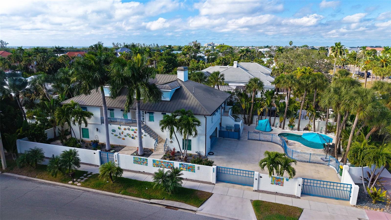 Experience refined coastal living in the heart of St. Armands Circle, Sarasota’s premier destination for luxury shopping, fine dining, and island living. This fully turnkey, furnished 4-bedroom, 3.5-bath residence is ideally located just steps from world-class amenities and a short stroll to Lido Beach.

Extensively renovated with coastal elegance in mind, this home features impact-rated windows and doors, a new roof with skylights, updated HVAC systems, designer flooring, remodeled bathrooms, upgraded lighting, and premium finishes throughout. The chef’s kitchen showcases Wolf, Sub-Zero, and Bosch appliances, quartz countertops, and custom cabinetry.

The private outdoor retreat offers a fully renovated pool, travertine decking, lush landscaping, modern fencing, copper gutters, and a custom privacy wall featuring ceramic artwork by a celebrated Florida artist.

Located in one of Sarasota’s most iconic destinations, this rare turnkey residence offers a unique opportunity for full-time living, a seasonal retreat, or an exceptional rental opportunity. Embrace effortless access to Lido Beach, St. Armands Circle, and the best of Sarasota’s island lifestyle.