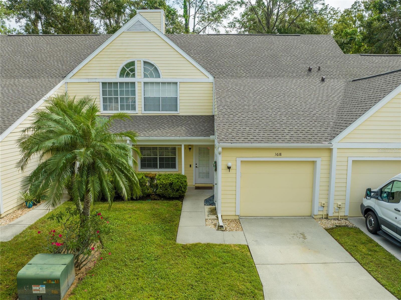 Beautiful townhome that has been meticulously maintained. From the moment you walk up and see the front covered porch you will feel at home. Open the door to your spacious living room with wood burning fireplace with tile surround. Then enter your large dining room that leads through sliding glass doors to your private screened in patio overlooking treed conservation area. No back yard neighbors. Beautiful, engineered wood floors flow from the front door through home. Ceiling fans throughout home have remotes for fan and light. Kitchen is convenient and has stainless appliances. Window over sink allows you to view conservation area from your kitchen. Downstairs also has a ½ bath, under the stair’s pantry, door to oversized one car garage with door opener and key pad outside. Up stairs you have 2 large bedrooms with vaulted ceilings and gorgeous solid wood doors that were added. Also, upstairs you have a 5’x6’ storage closet at the top of the stairs. The community also has a pool and spa with a covered entertainment area, showers and rest rooms. Also, your water, roof maintenance, grounds maintenance, exterior maintenance, pool maintenance and flood insurance is included in your HOA dues. You are minutes from shopping and restaurants. Call today to see your new home.