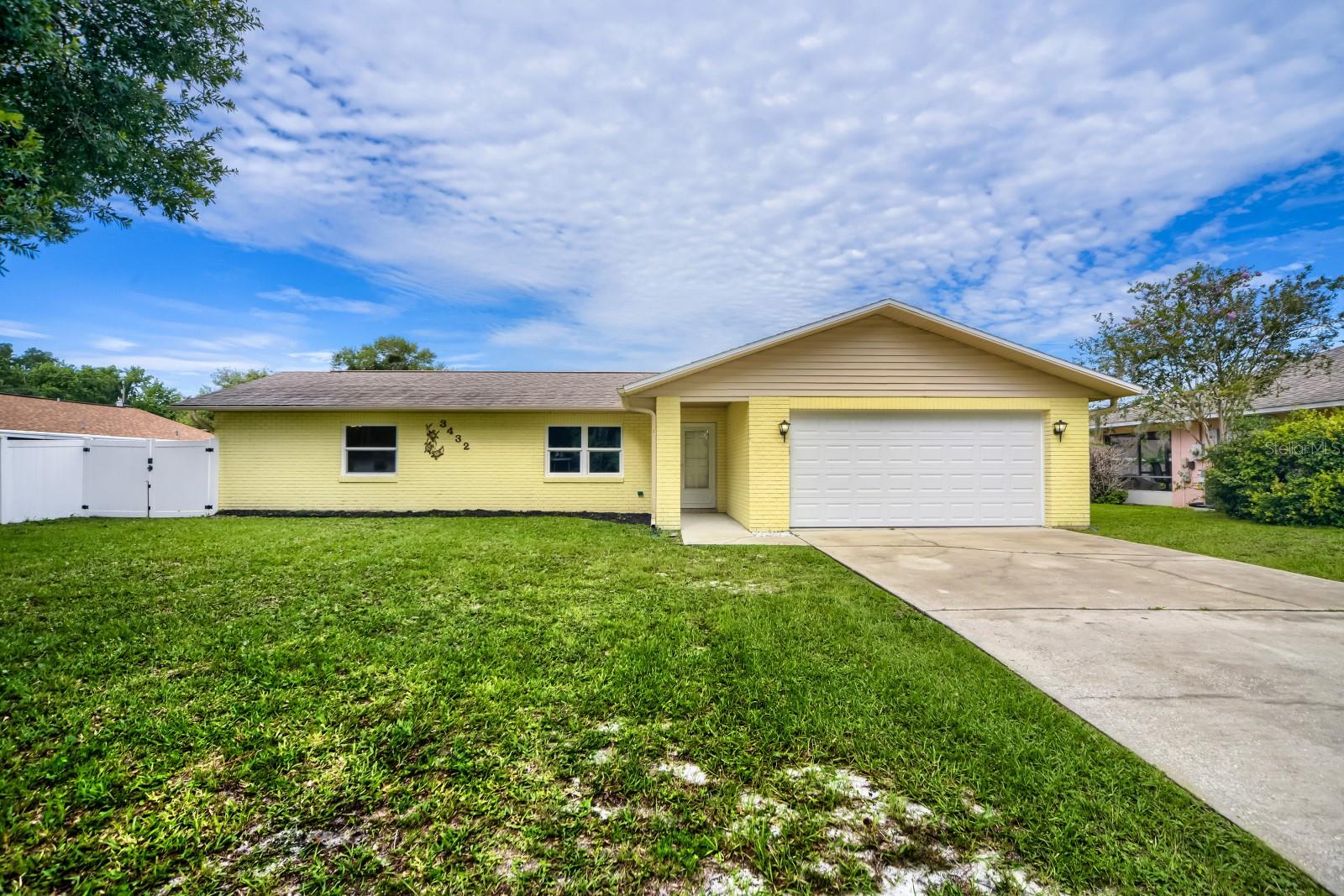 Welcome home to this charming 3-bedroom, 2-bath concrete block residence in the desirable Florida Shores community of Edgewater! Offering 1,228 square feet of comfortable living space, this home features a functional split-bedroom floor plan, spacious living areas, and a screened Florida room perfect for relaxing or entertaining. Enjoy a fully fenced backyard with plenty of room for pets, play, or even a future pool, plus a large workshop/storage shed for all your tools and hobbies. Conveniently located near shopping, dining, schools, parks, the Intracoastal Waterway, and just a short drive to New Smyrna Beach, this property offers the perfect combination of comfort, convenience, and Florida living. Don't miss your opportunity to make this home yours!