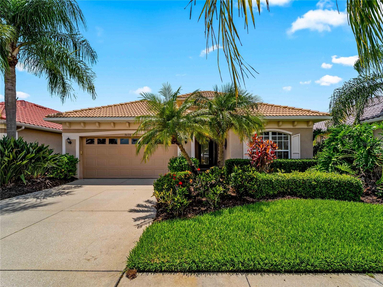 Welcome to 5435 Blue Heron Circle, a beautifully maintained 3-bedroom, 2-bathroom home with a 2-car garage nestled within the highly sought-after gated golf community of Heron Creek Golf & Country Club. Perfectly positioned on a tranquil natural preserve, this exceptional residence offers privacy, comfort, and an outstanding Florida lifestyle.

Step through the welcoming foyer and immediately appreciate the soaring ceilings, elegant tile flooring, recessed lighting, and spacious open-concept design. The thoughtfully designed kitchen is a chef's delight, featuring 42-inch wood cabinetry, granite countertops, a granite backsplash, breakfast bar, butler's pantry, and a casual dining area overlooking the serene preserve views.

The versatile floor plan offers both formal and casual living spaces, with a spacious living and dining room flowing seamlessly into the family room—ideal for entertaining guests or enjoying everyday living. The light-filled primary suite is a true retreat, featuring peaceful preserve views, dual walk-in closets, double vanities, and a large walk-in shower. A generously sized guest bedroom provides ample storage, while the third bedroom doubles perfectly as a home office and includes a built-in entertainment center along with two twin Murphy beds for visiting family and friends.

Residents of Heron Creek enjoy world-class amenities including 27 holes of championship golf across three 9-hole courses, tennis courts, a resort-style pool and spa, fitness center, clubhouse, and both casual and fine dining options—all within the community.

Conveniently located just minutes from Cocoplum Village Shops, The Shoppes at Price Crossing, and numerous dining and retail destinations along U.S. 41, this home also offers quick access to I-75, making travel throughout Southwest Florida a breeze. Healthcare facilities including Sarasota Memorial Hospital–North Port and HCA Florida Fawcett Hospital are just a short drive away, providing peace of mind and convenience.

Experience the perfect combination of luxury, lifestyle, and location. Schedule your private showing today and discover all that Heron Creek has to offer.
