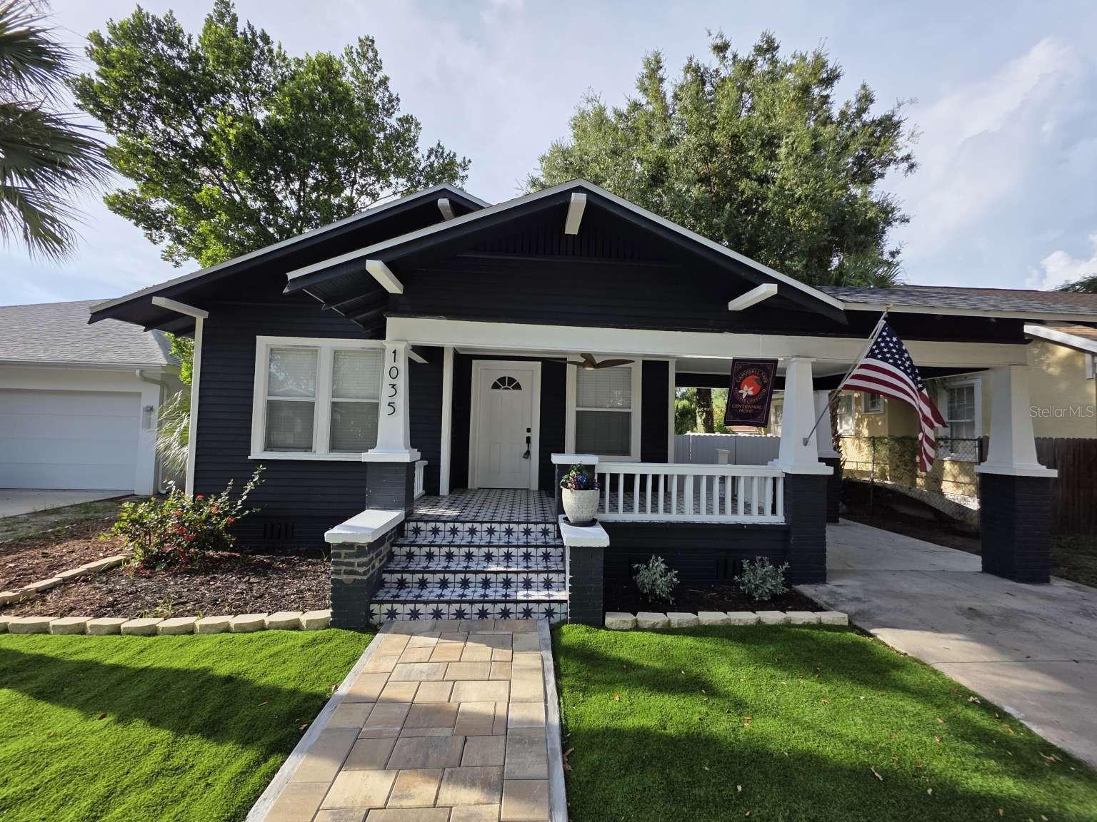 Outstanding, fully renovated and restored, 1920's Craftsman style home on large lot, walking distance to downtown! NOT in flood zone, no flood insurance required! NO HOA.
This 3 bedroom, 2 full bath home boasts 1200 square feet (estimate, from survey) of living space and blends updated, modern features with tons of character and original elements.

From the spacious covered front porch, enter to a open living-dining room area complete with wood burning fireplace. A restored build-in graces the dining area, and a completely new kitchen with ALL NEW LG appliances is just beyond the bar area - including range with air fryer. The kitchen has been opened, enlarged and a new exterior door added to access the fully fenced yard. Original, restored wood floors flow throughout the house. Every window has fitted faux wood blinds. NEW lighting, remote operated fans, fixtures, wall improvements, toilets, interior 6-panel doors, and fresh paint are also throughout.

Upon entering, also notice the unique and visually stunning single-piece, custom stretch PVC ceiling. Waterproof and maintenance free, this gloss ceiling is quite a statement. Both original bedrooms also feature this, but in a matte finish. Halls, baths, and primary bedroom are drywall or wainscot ceilings.

The hallway leads to three larger sized bedrooms and a cozy full bath with new Brazilian tile shower, plus a newly added laundry area with brand new stacked LG washer and dryer. The primary bedroom and ensuite bathroom have been totally renovated, while keeping the original wainscot walls and ceilings that once made up the back porch. Also, the primary suite has its own private access to the backyard!

Outside, what was a overgrown mess has been converted into a private, completely fenced oasis of tropical palms, all new landscaping, new fencing, new custom paver patio, artificial turf surrounding the entire space and side of house, overhead string lighting, and a custom block firepit area. The remainder of the unimproved backyard has ample space for your ideas, from sod or gardens to a pool, ADU, hot tub, or other outbuildings. With no HOA and NOT in a restricted historical area (it is historic, but not with restrictions like other neighborhoods), it's a blank canvas for all your ideas!

All the major items have been recently or newly updated: all wiring has been updated, all plumbing has been updated or is new with this renovation, roof is 3 years old, HVAC system is 4 years old. Additionally of note, a past termite-damaged and rotted main wood truss supporting the front porch roof was totally removed and replaced with new, pressure treated set of 2x12's and new fascia surrounded. This damage was not new, it was long ago and no signs of active termites were discovered! But, it is worth mentioning as it makes this home as solid as it ever was.

It's a great neighborhood with partially brick, tree lined divided avenue.

A professional survey was done on the property prior to adding fencing, and is included. Off-street parking on newer concrete driveway with carport can accommodate up to two average sized vehicles, or one large vehicle. See survey photo for dimensions. On-street also allowed.

Though the tax parcel information indicates 1017 square feet, the survey exterior dimensions show approximately 1200 square feet of space.

Come check out this outstanding piece of restored old Florida while it lasts!

Some photos are digitally altered/staged.