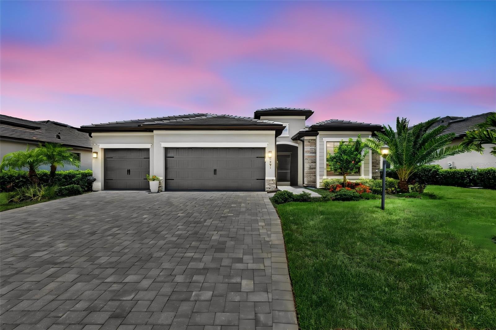 A Step Above The Rest in Lorraine Lakes, this model-perfect, move-in-ready home offers 2,239 square feet of elegant living space with four bedrooms, two bathrooms, a formal dining room, a larger breakfast nook, and a spacious three-car garage. Inside, you will find a gracious foyer leading to an open-concept family room that flows seamlessly into a modern kitchen complete with white cabinets and granite countertops, plus a primary suite featuring dual sinks and a walk-in shower. The exterior boasts a durable tile roof, full gutters, full house generator, a paver driveway, and a fenced backyard enclosing a covered paver lanai with a heated saltwater pool and spa. This exceptional outdoor oasis overlooks a rare, tranquil pond and preserve view, allowing you to enjoy Florida’s year-round sunshine. Situated in a 24-hour gated community that includes lawn maintenance, residents enjoy resort-style amenities such as a fitness center, walking trails, a lap pool, a full-service restaurant, a tiki bar, a professional indoor basketball court, tennis, volleyball, and pickleball courts. Set in Lakewood Ranch for all the events, shopping, restaurants, parks, walking and biking trails. Newly updated Premier Sports complex and library down the street. Close to Sarasota downtown, St Pete, Anna Maria Island and an hour to the Tampa scene. This is a perfect home in one of the finest areas of our country.