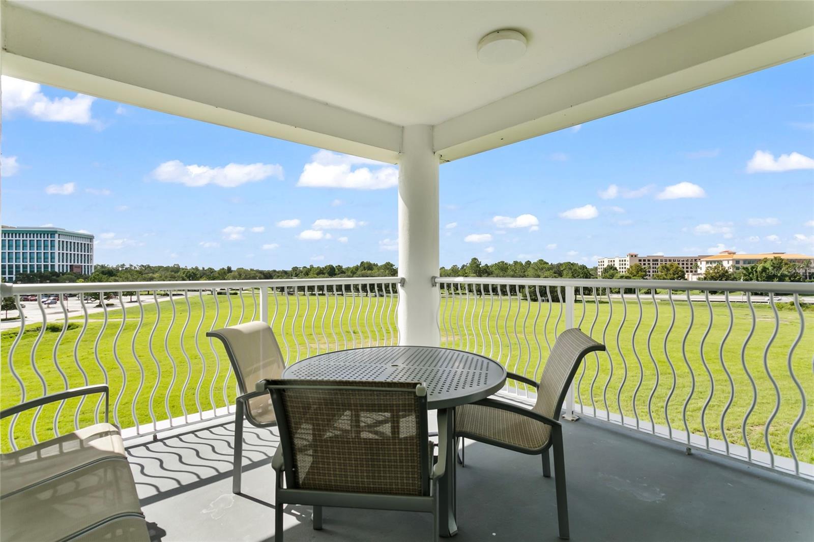 *****NEW UPDATED, MODERN FURNITURE PACKAGE***** This stunning, fully furnished 2-bedroom, 2-bathroom condo is situated in the highly sought-after Melia Orlando Suite Hotel in Celebration. As a condominium hotel, it provides exceptional accommodations, amenities, and services for both guests and owners. Located just minutes away from major theme parks such as Disney, Universal Studios, and Sea World, this property offers an ideal location. The Melia provides private transportation to the theme parks, and guests can also request a complimentary day pass to the Celebration Health gym and spa, which is conveniently located across the street.

The condo features a spacious, modern floor plan, complete with two private balconies that spectacular views of Celebration and the surrounding areas. Inside, the condo includes a comfortable living room and a kitchen equipped with elegant stainless steel appliances, designed for both style and functionality. The primary bedroom is inviting and includes a bathroom with both a tub and a separate glass shower stall.

The Melia offers an impressive array of amenities, including a community resort pool with a 360-degree vanishing edge, a poolside restaurant and bar, a gift shop, and executive conference rooms. Additional features include a checking desk for convenience, a dog walking park, a beach volleyball court, mini soccer/ football pitch and a picnic area.

The hotel is renowned for its excellent customer service and maintenance standards. The quarterly HOA/COA fees cover all utilities and recreational facilities. Owned and operated by The Melia Group, a renowned European hotelier, this property is well-maintained and conveniently located near Celebration, Water Tower Place shopping, and local dining options. It offers easy access to theme parks, Orlando International Airport, and both East and West coast beaches. This unit is perfect for personal use or for foreign nationals seeking a vacation retreat. Additionally, the hotel manages the property effectively during non-use periods, providing a hassle-free investment.

This condo is a must-see for those looking to combine personal enjoyment with the benefits of hotel management.