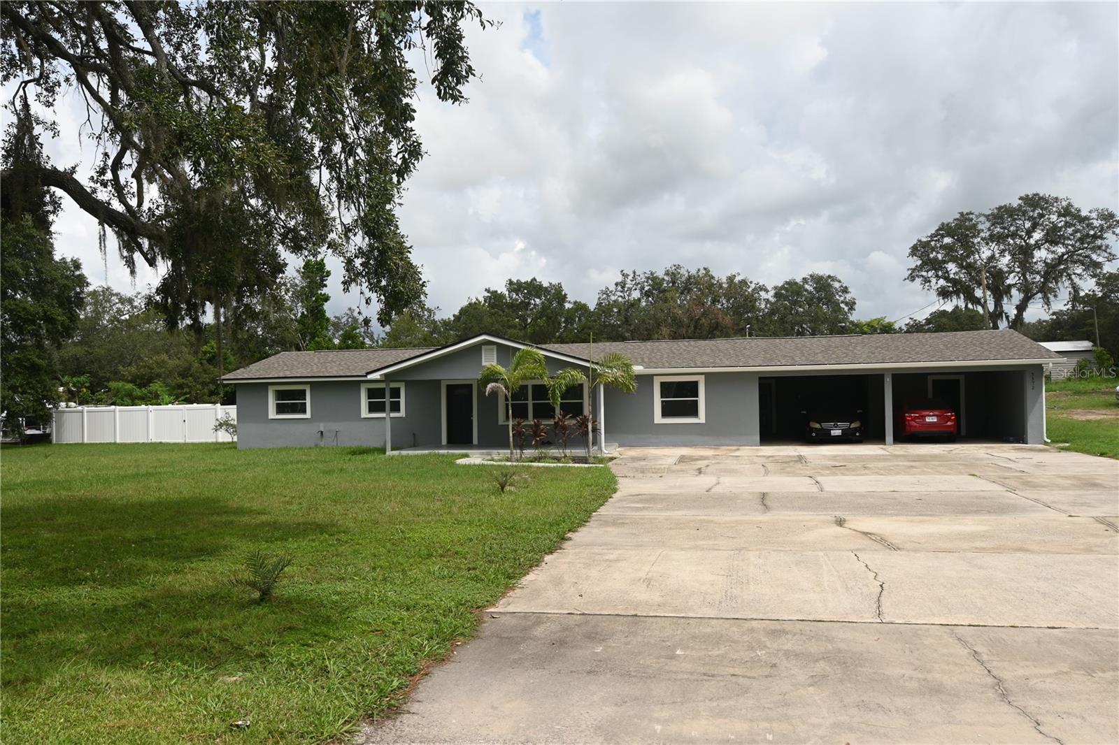 INCOME PRODUCING PROPERTY! This property consists of 2 homes on just under 2 acres. The first home is a fully renovated 2,308 square feet, 4 bedroom/2-bathroom rental property that is fully occupied.  The entire home features easy-to-maintain ceramic tile flooring, a brand-new roof, and all new appliances and fixtures. The shared spaces of the home are large, bright and inviting. The second home is a 950 square foot 3 bedroom/2-bathroom rental next door. This home has maintained a long-term tenant whose lease can be transferred to the new owner. For those who love the outdoors, both properties have a HUGE front and back yard, long driveways, and a carport to store vehicles and outdoor equipment. The larger home is complete with a fenced in back patio, a shed and small outdoor storage building.