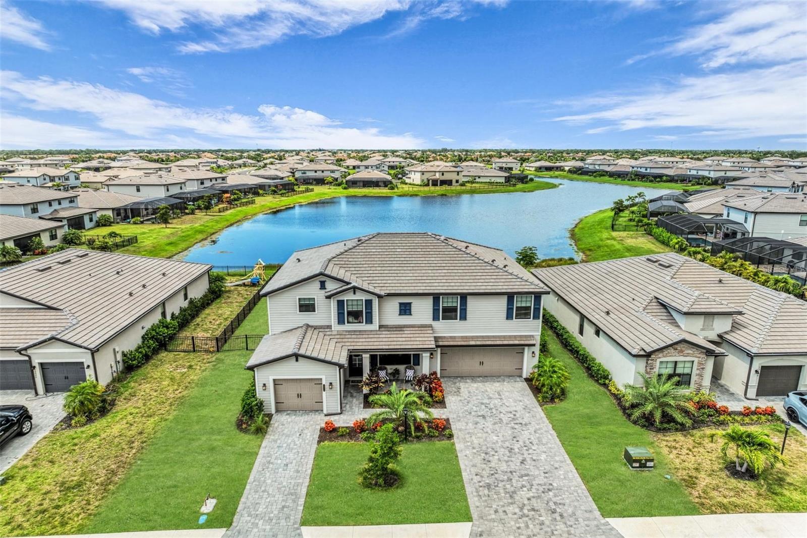 Beautiful water views, exceptional space, and impressive upgrades make this one-of-a-kind home a must see. Enjoy a prime Lakewood Ranch location in the popular Lorraine Lakes neighborhood. This spacious residence features 5 bedrooms, 4.5 bathrooms, and a modern design with ample space for a home office, gym, or reading nook. The home is centered around a spacious kitchen perfect for entertaining. A large, covered lanai leads to a fenced-in backyard with plenty of room for a pool. Enjoy easy access to community amenities including a clubhouse with resort-style pool and splash park, sports courts, Pickleball, fitness center, fishing pier, kids club, restaurant, Tiki bar, and planned events throughout the year. Schedule a private showing today.
