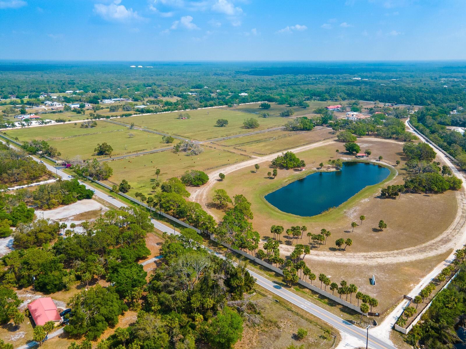 Venice, Florida 102-acre Ranch! This is a rare opportunity to purchase one of the few remaining large acre parcels in beautiful Sarasota County, Florida, less than 8 miles from the Gulf Beaches. Currently zoned OUE/OUR which will potentially allow for future subdivision of parcels. Loaded with potential, the future development possibilities are endless. Privacy abound, this walled and gated property has over six wells and two ponds on-site, with access to Blackburn Canal/Curry Creek and is currently being utilized as a residential livestock ranch containing a guesthouse, storage garages and a barn with 21 stables. The list of possible potential uses for this one-of-a-kind property includes an equestrian center/polo club, plant nursery and landscaping supply, animal hospital with boarding and sheltering, parks and open spaces, sporting events center, or complete the current estate home and guest houses and subdivide to create multiple homes or a large family compound. Many of these uses would support the area and compliment the newer home communities by national and local residential builders located just minutes from the property. Only a few miles from the world-class beaches of the Gulf Coast, numerous shopping and dining options close by, and a short drive to the interstate, make this location easy and convenient for all uses while still providing solitude and privacy. Ready for beautiful year-round weather and tired of high tax states? Come take advantage of the green belt tax benefits and lower costs of living with this beautiful Venice, Florida, unique opportunity.