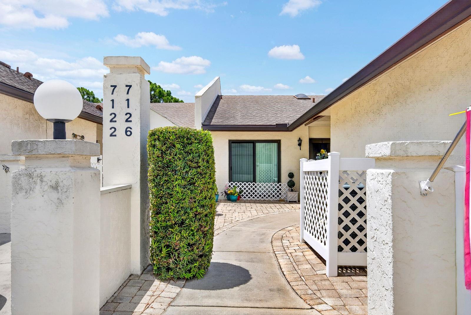 Welcome to Country Village — a rare opportunity to own a villa with an attached garage in a prime location close to shopping, dining, and the area’s beautiful beaches.

This spacious 2-bedroom, 2-bath home features an open and inviting layout with soaring ceilings, beautiful flooring, and generous living areas perfect for relaxing or entertaining. The large kitchen offers abundant cabinet storage and ample counter space, making meal prep a breeze. A conveniently located closet includes a full-size washer and dryer.

The split-bedroom floor plan provides added privacy, with the guest bedroom and bath tucked away in their own wing along with an additional storage area. The oversized primary suite features a walk-in closet and a well-appointed en-suite bath.

Enjoy peaceful mornings or evenings in the enclosed rear lanai overlooking green space with no rear neighbors. Residents of this well-maintained community also enjoy access to a community pool and clubhouse.

Priced to sell — this one won’t last long!