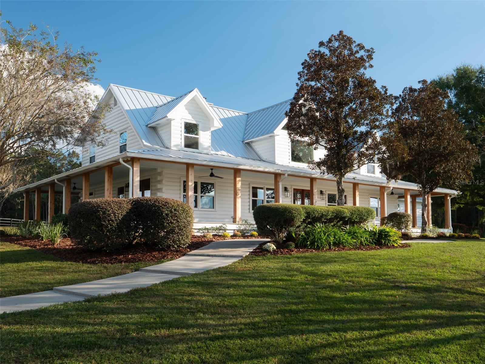 This 82 acre jem will capture your heart and inspire your imagination from the moment you arrive. Rolling green pastures and Grandaddy Oaks surround this fully renovated modern farmhouse. Professionally designed, custom cabinetry, quartz countertops as well as Viking appliances appoint this comfortable home. 
From the wrap around porch, you can enjoy a sunset or take in the wildlife that calls this property home. 
A 2 acre fully stocked spring-fed pond, teaming with trophy large mouth bass or huge blue gill, is a short walk from the porch. The property offers a 10-stall barn, which features a 3-bay garage, and workshop.  Its centrally located; Ocala, Gainesville, as well as the quaint towns of McIntosh and Micanopy, are just minutes away.  The renowned World Equestrian Center is 23 minutes away, and the new WEC at Ocala Jockey Club is literally at your back door!!  This meticulously maintained, and beautifully landscaped farm, is sure to bring you years of enjoyment. Properties like this don’t come along often.