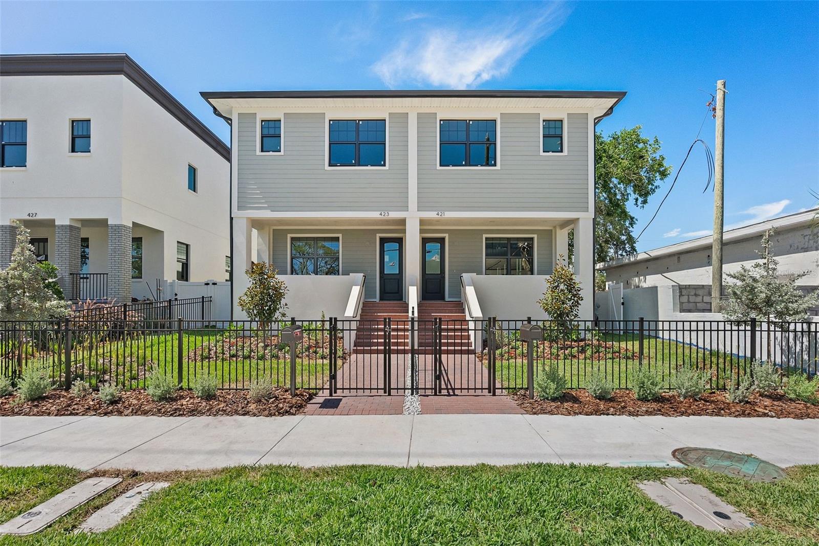 Welcome to the Roser Park Townhomes – an exclusive collection of six stunning residences in one of St. Petersburg’s most beloved historic neighborhoods. Move-in ready and designed for today’s lifestyle, these homes pair modern sophistication with timeless character just minutes from Downtown St. Pete. Each residence offers a thoughtfully designed 3 bedroom, 2.5 bath main home complemented by a detached two-car garage with a fully finished 1 bedroom, 1 bath suite above – perfect for guests, extended family, or private office space. The Roser Park Townhomes are a contemporary interpretation of St. Pete’s architectural heritage. Arranged in three clusters of two, each home features its own distinctive exterior, blending seamlessly with the neighborhood’s charm. Inside, the open floor plan welcomes you with a bright and airy living room, dining space, and a chef’s kitchen with a large pantry – ideal for entertaining and everyday living. Upstairs, retreat to three spacious bedrooms and two full baths, including a serene primary en-suite. Step outside to enjoy your private backyard oasis, perfectly positioned between the main home and the detached garage. A covered front porch nods to Roser Park’s historic appeal, while modern finishes and quality craftsmanship deliver comfort and peace of mind. Situated directly across from the new ARK Innovation Center and within minutes of downtown dining, arts, and waterfront attractions, the Roser Park Townhomes offer the best of both worlds: historic character and modern convenience. Discover a rare opportunity to own an exclusive residence in one of St. Petersburg’s most iconic and connected neighborhoods.