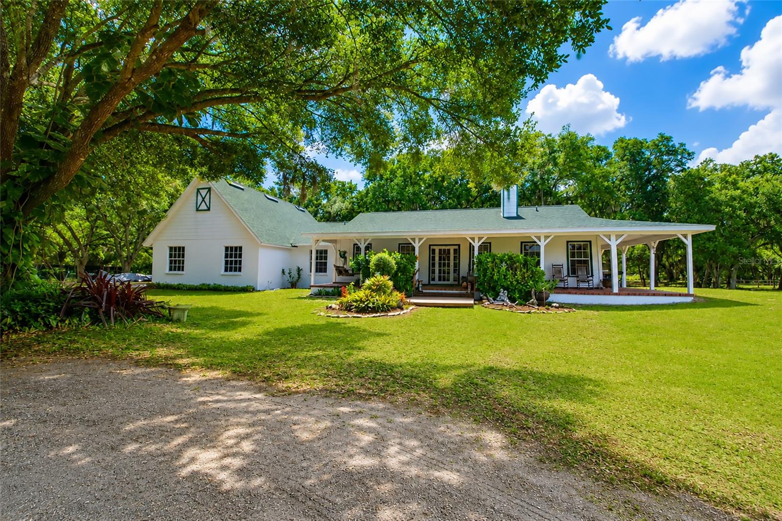 Buyer financing fell through and your opportunity to experience country living with both privacy and comfort with this exceptional 5.18-acre home located in the highly desirable but rarely available Mossy Hammock community is still available. Tucked away at the very end of the community on a quiet dead end setting, this beautiful oak-lined property is surrounded by hundreds of acres of protected conservation easement land and bordered by a large local grower farm behind the property, creating an incredibly private and peaceful retreat with breathtaking Old Florida scenery. Built with durable concrete block construction and lovingly maintained by its original owners, this spacious 3 bedroom, 2 bathroom home offers just under 2,000 square feet of living space with raised ceilings and an open layout that makes the home feel even larger. Natural light pours throughout the interior, enhancing the warm and inviting atmosphere while showcasing the tranquil views of the surrounding acreage and majestic mature oak trees. Have peace of mind with a NEW ROOF INSTALLED IN 2024 and a NEW HOT WATER HEATER INSTALLED 2025. To further reassure buyers, the SELLER'S HAVE COMPLETED A PRE LISTING 4 POINT INSPECTION AND A CLEAN 4 POINT REPORT IS ATTACHED TO MLS. For buyers searching for flexibility and future potential, this property also offers the opportunity to add a 4th bedroom and expand the air-conditioned living space, making it ideal for growing families, multigenerational living, a home office, hobby space, or additional guest accommodations. The Agricultural zoning makes this property especially attractive for buyers seeking a true country lifestyle without sacrificing convenience. Bring your horses, chickens, goats, and other feathered or furry friends while still having plenty of room for your RV, boat, trailers, work equipment, ATVs, golf carts, and all your recreational toys. With wide open usable acreage, this property is ideal for homesteading, gardening, hobby farming, outdoor entertaining, or simply enjoying wide-open space and nature.
This rare acreage home combines many of today’s most sought-after real estate features including:
• Concrete block construction
• High ceilings and spacious floor plan
• Room to expand
• Agricultural zoning
• No cramped suburban living
• Space for RV and boat parking
• Horse-friendly property potential
• Peaceful conservation views
• Ultimate privacy with no rear neighbors
Properties offering this level of privacy, usable land, mature oak trees, conservation surroundings, and future potential are becoming increasingly difficult to find in today’s Florida real estate market. Whether you are searching for a private family estate, hobby farm, equestrian-friendly property, country retreat, or simply more freedom and space to enjoy life, this exceptional Mossy Hammock property delivers a rare opportunity to own your own slice of paradise.