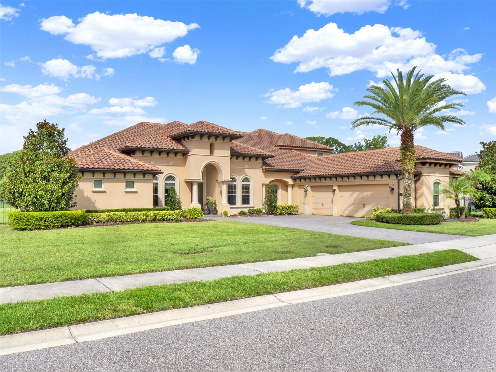 An extraordinary sanctuary awaits in highly sought-after Steeple Chase community of Lake Mary, where timeless elegance, serene natural beauty, and modern luxury converge on a private one-acre estate. Perfectly positioned to capture tranquil views of Rice Lake and protected conservation areas, this exceptional residence offers an unparalleled blend of luxury, privacy, and natural surroundings. Designed for both grand entertaining and everyday comfort, the home features expansive living spaces, soaring ceilings, and designer finishes throughout. The exquisite chef’s kitchen is equipped with premium Sub-Zero and Wolf appliances, a convenient pot filler, and exceptional functionality sure to impress even the most discerning culinary enthusiast. Thoughtfully designed for comfort and privacy, each bedroom features its own en suite bathroom, creating a luxurious retreat for family members and guests alike. Oversized windows and thoughtfully designed indoor-outdoor living areas showcase the breathtaking backdrop while filling the home with natural light. Step outside to your private resort-style retreat, where a sparkling pool and spa overlook the peaceful lake and lush conservation views. The fully equipped summer kitchen features a built-in grill with vented hood, sink, and beverage refrigerator, creating the perfect setting for outdoor entertaining. Whether hosting gatherings under the covered lanai, enjoying a sunset soak in the spa, or relaxing poolside in complete privacy, this home delivers an exceptional lifestyle experience. Residents of Steeple Chase enjoy 24-hour gated security, private park access, and a prime location near top-rated Seminole County schools, upscale dining, boutique shopping, and major roadways, providing convenient access to just about everything.