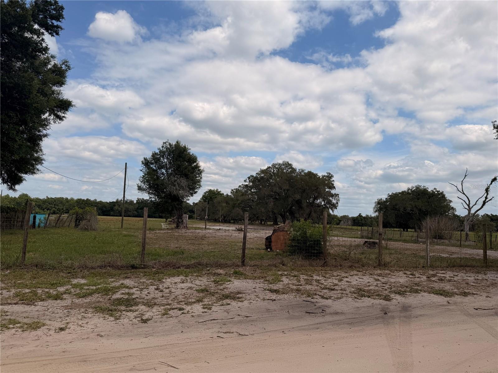 This fenced 4.28 acre property is located in Northeast Pasco County close to the Withlacoochee River. The property is centrally located between Tampa, Orlando and Ocala, FL. It is conveniently located close to I-75. The property had a home on it that burned and had to be demolished.   The property is zoned Agricultural/Residential Vacant Land. The property is in a NO Flood Zone according the the Pasco County Property Appraisers office. It does have a well (to be verified if working) and septic (to be verified if working) as well as a power pole at the front of the property and an additional power pole at the back of the property which were recently disconnected. Buyers wishing to build on the property or place a manufactured home on the property will need to go through the process with Pasco County to get permission to build or place a manufactured home on the property. Call to schedule your private showing.
