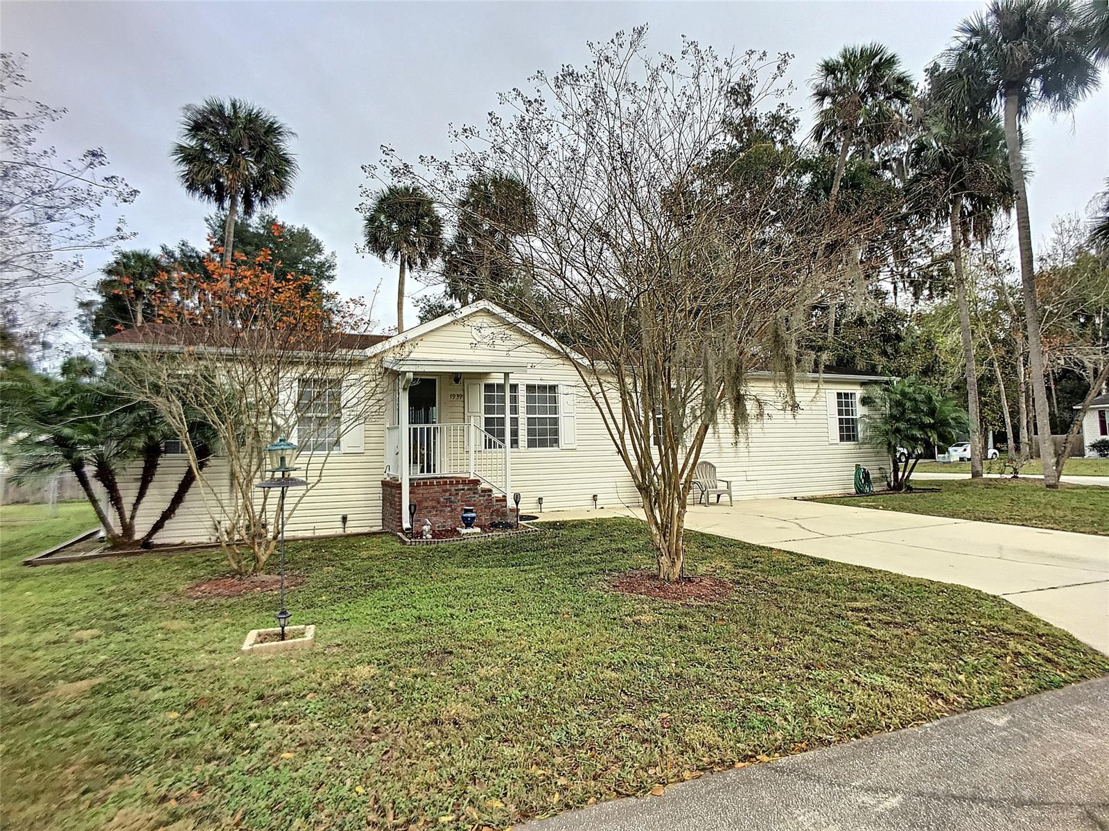 NO LOT RENT, YOU own your land.  Country setting. Enjoy a quiet peaceful community,  great neighbors, no traffic within the neighborhood. 1 mile to NSB High School & Daytona State College.  2 miles to Hwy 44, shopping & restaurants. Minutes to the Intracoastal waterway, the Atlantic Ocean, boat ramps, fishing, Canal St & Flagler Av events & Art Galeries . Home features a welcoming spacious living room, catherdral ceilings, family room with a wood burning fireplace, large kitchen with center island & breakfast bar.  Sliding glass doors lead to a fenced back yard. Spacious utility room with washer & dryer inside this home.  Super clean, Smoke free home from day one! A/C new in 2017 with UV light just installed. New bathroom room facuets & Hot water heater new in 2019. Wood laminate floors in living room & dining room 2016.  This home is clean, cared for & ready for you to move in! ;Water: City