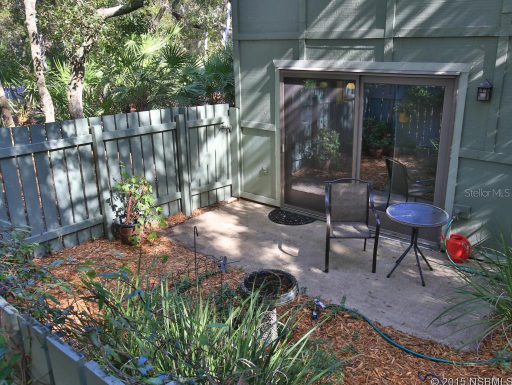 Expect to be impressed when you enter this beautifully renovated townhome in the Timbers Edge section of the Trails. This end unit is open to community green space and walking trails visible from all rooms. The owner has updated every room flawlessly. The previous family room is now a spacious third bedroom with a pocket door. The kitchen is totally remodeled with sleek modern cherry wood cabinets, tile counter tops, stainless appliances and a unique poured concrete breakfast bar. The lower cabinets include easy access roll-out shelves, a pull out waste cabinet and extra deep storage drawers for pots and pans. The sink is extra deep with pull down spray faucet and water filter. There is even a pot filler faucet over the glass top range. All original windows have been replaced by new high impact, wind resistant, dual pane aluminum windows. The sliding door to the patio is Anderson metal-clad wood. Both bedrooms upstairs have their own baths. The master bath has been reconfigured to include a dressing area, a Kohler Steeping tub, a 38" pedestal sink and a frameless glass shower surrounded by decorative tile. A full sized washer and dryer is the walk-in closet of the second bedroom makes laundry a breeze. This special townhome is ready for a new owner-make that appointment to see it now! ;Water: City