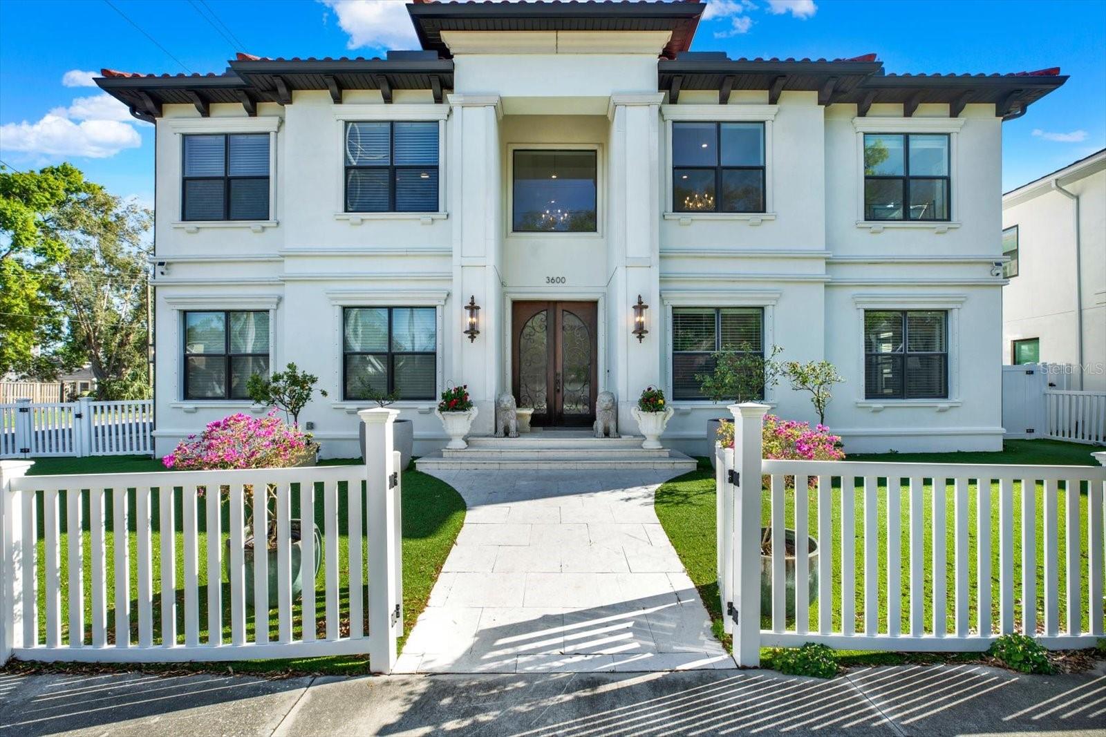 Welcome to 3600 West San Luis Street, an architecturally refined and custom-built residence, offering an elevated blend of design, comfort, and effortless indoor-outdoor living in the highly sought-after Plant High School district. 

A grand entry begins with dramatic double doors that open to an impressive foyer, where a sweeping spiral staircase is complemented by three chandeliers—creating a striking and sophisticated first impression. Thoughtfully designed with an emphasis on flow and balance, the home offers a seamless transition between spaces, enhancing both everyday living and entertaining.

The true centerpiece of the home is the wall of sliding glass pocket doors that collapse into the walls—blurring the line between indoors and out. This signature feature transforms the living space, inviting in natural light and expanding the home’s footprint to create an exceptional indoor-outdoor lifestyle experience.

Outdoors, a private retreat awaits. The heated saltwater pool and spa are set within an enclosed lanai, complemented by an outdoor kitchen—perfect for hosting or relaxing year-round. The grounds are wrapped in 360-degree turf for a refined, low-maintenance aesthetic, while the absence of large trees allows for effortless upkeep. A durable tiled roof adds both beauty and longevity.

Inside, the kitchen showcases rich wood cabinetry, wine refrigerators, and quality finishes that reflect attention to detail throughout the home. Additional features include a storage shed and a gun safe for added convenience.

Positioned approximately 16 feet above sea level, the property is high and dry—offering both peace of mind and long-term value.

This is a truly custom-built residence where thoughtful design meets elevated living in one of Tampa’s most desirable locations.