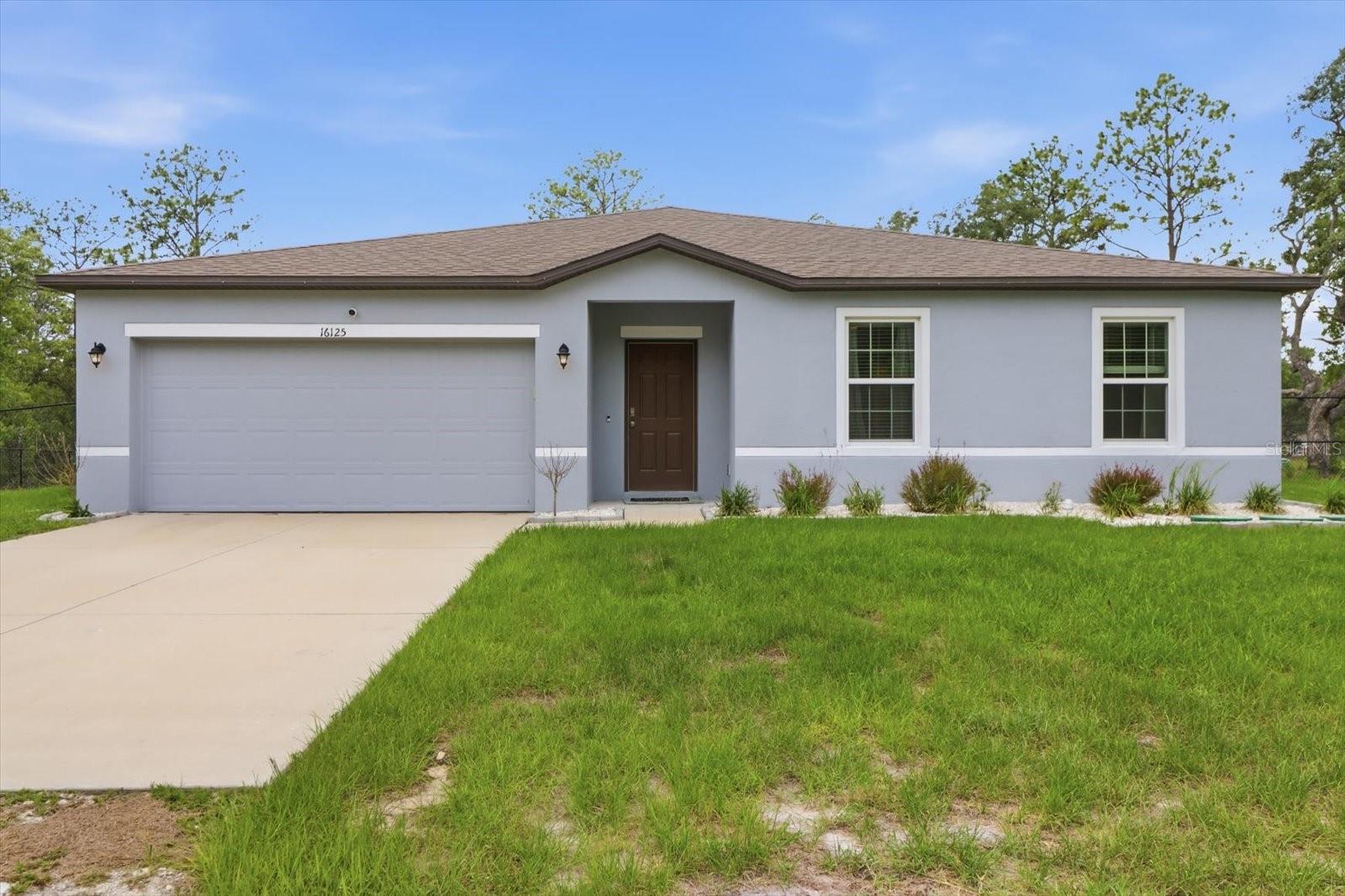Welcome to this beautiful 2022-built home in Royal Highlands, offering the perfect blend of modern design, comfort, and privacy. Situated on a fully fenced 1-acre lot, this 4-bedroom, 2-bathroom home features a desirable split floor plan and new luxury vinyl flooring throughout, tile in the wet areas and carpet in 3 guest bedrooms. The open-concept layout seamlessly connects the kitchen, dining, and living areas, creating an ideal space for everyday living and entertaining. The kitchen is the heart of the home, complete with a large center island, pantry, and sliding glass doors that lead to the spacious backyard and patio—perfect for grilling and outdoor gatherings. The fully fenced property provides endless possibilities, whether you need space for your boat, RV, pets, hobbies, or simply want to enjoy the privacy and freedom of country-style living. Additional features include an ADT security system for added peace of mind. Conveniently located near Spring Hill and Brooksville, you'll enjoy easy access to shopping, dining, schools, and everyday amenities. Outdoor enthusiasts will love being close to the Gulf Coast's renowned boating, fishing, kayaking, and scalloping opportunities. Tampa International Airport is also within a comfortable drive, making travel a breeze. Don't miss your opportunity to own this move-in-ready home with room to live, play, and grow.