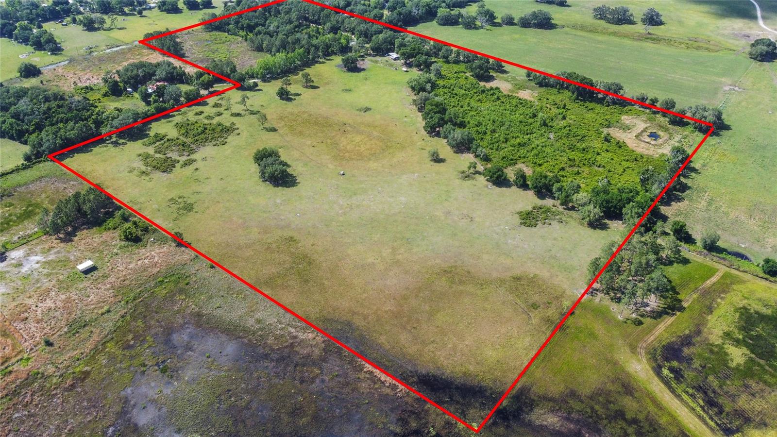 Escape the hustle and bustle of city life and immerse yourself in the tranquility of this picturesque 50-acre property, where endless possibilities
await nestled in a quiet area, this expansive parcel of land offers the perfect canvass for creating your dream home and embracing a lifestyle of rural bliss. Or, it can become a community of homes at your own discretion. Prime Location: Situated in a serene and secluded area, yet close enough to Orlando and two oceans, if desired, to meet any need. Enjoy the peace and quiet of country living while still being within easy reach of essential amenities and urban conveniences. Build Your Dream Home or Community of homes: With ample acreage at your disposal, envision and create the perfect custom-built home tailored to your unique preferences and lifestyle. Whether you dream of cozy farmhouse retreat or a sprawling estate, the possibilities are endless. Space for Horses or Cattle: For equestrian enthusiasts or aspiring ranchers, this property offers the opportunity to fulfill your passion for horses or cattle. With plenty of open pastureland, there's ample room to graze, roam, and nurture your four-legged companions.