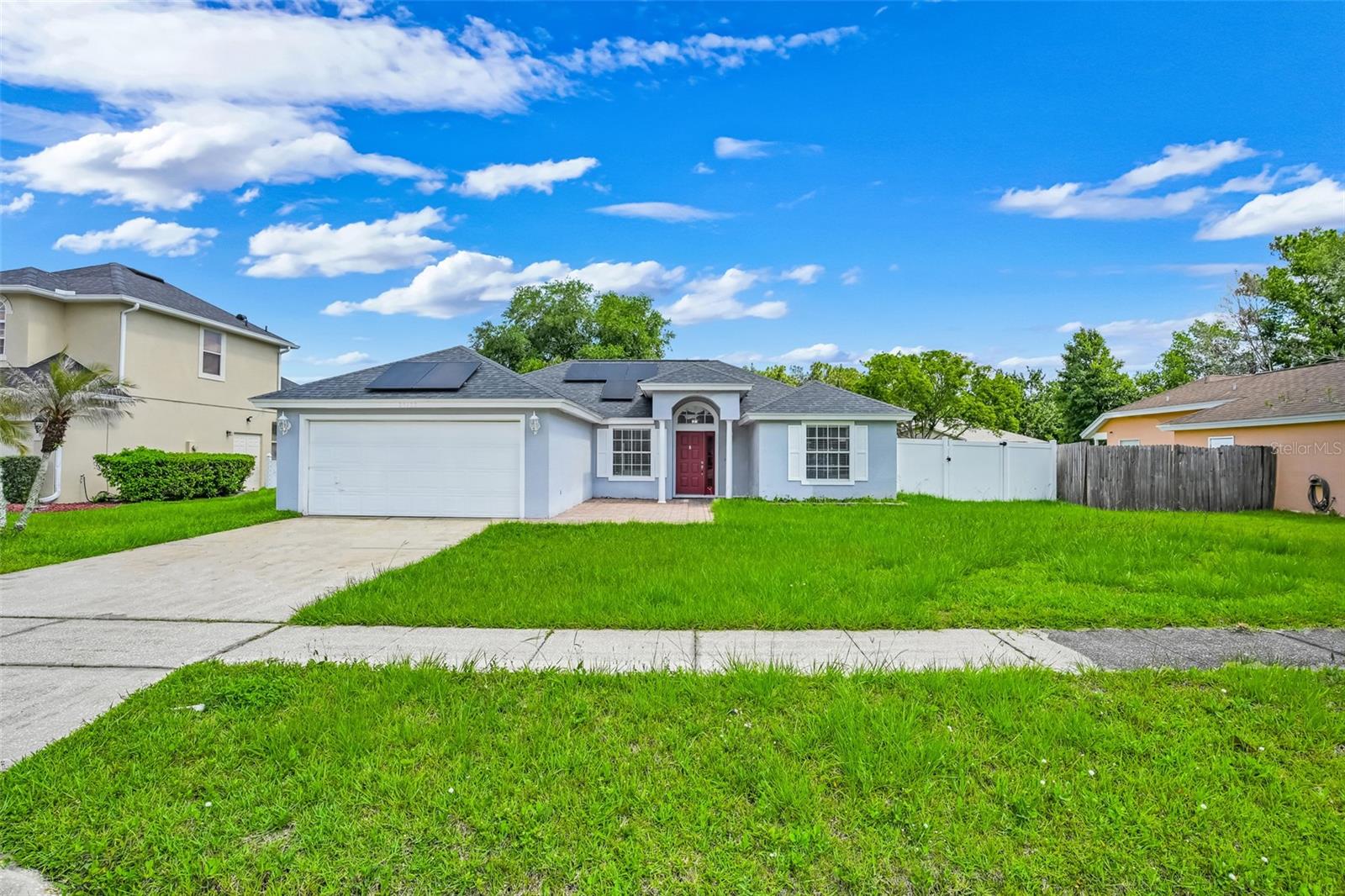 This beautiful move-in ready family home features a wide open and airy split floor plan with 3 bedrooms and a dedicated dining room that could easily be converted into a large 4th bedroom.  Gigantic screened patio overlooking the oversized fenced backyard.  Featuring 2021 roof and whole house solar which will be paid off at closing for free and clear ownership and immediate savings for your new home especially with optional HOA!  Great space with plenty of options for the savvy buyer in one of the most convenient and sought after neighborhoods in Central Florida!